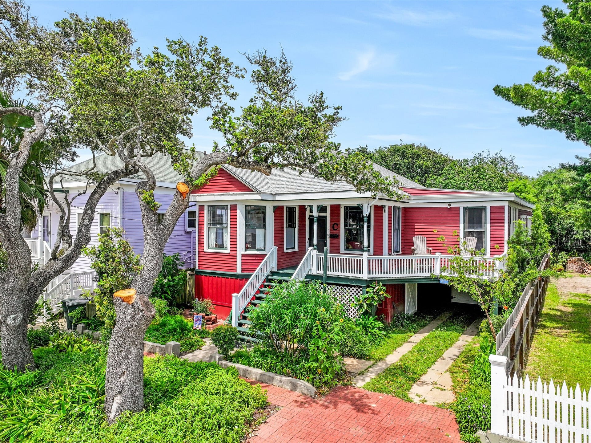 1518 21st Street, Galveston, TX 77550 Welcome to a timeless piece of Galveston, where vibrant coastal colors, mature live oaks, and lush tropical landscaping create an unforgettable first impression. Just blocks from the Seawall and beach, this beautifully preserved historic home invites you to slow down and embrace island living from the moment you arrive.
