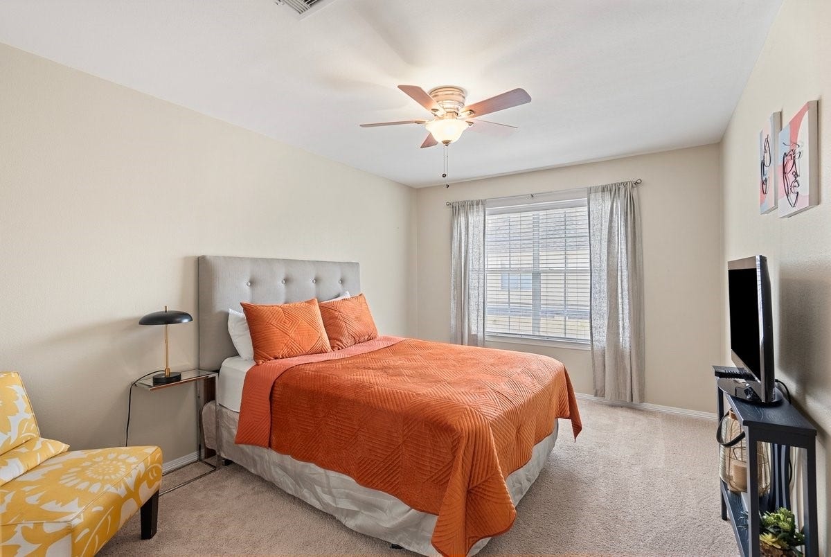 Each bedroom is equipped with ceiling fan and bright window!