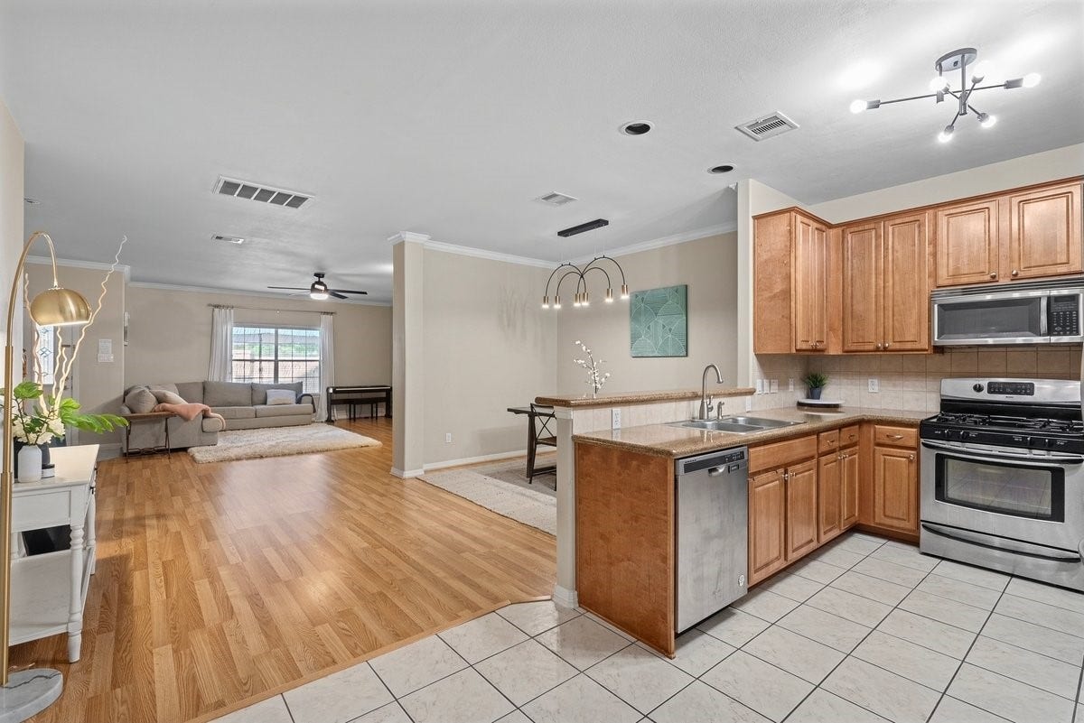 Never miss a minute of the action as the kitchen opens to the dining room!