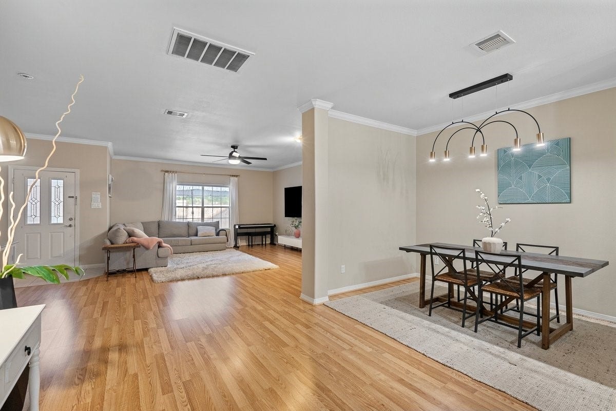 Perfect for entertaining, this open floor plan connects the living and dining rooms!