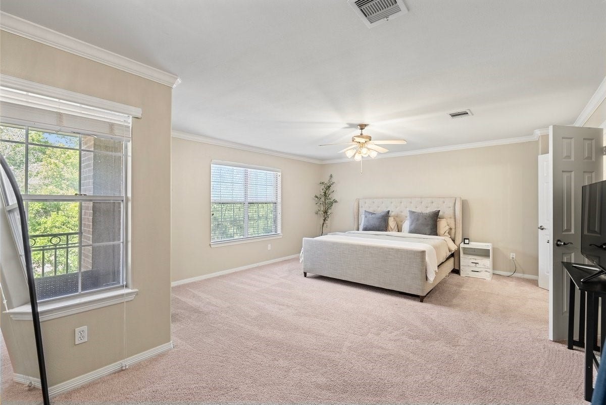 The oversized primary suite has additional space for a seating area, and large windows that invite natural light!