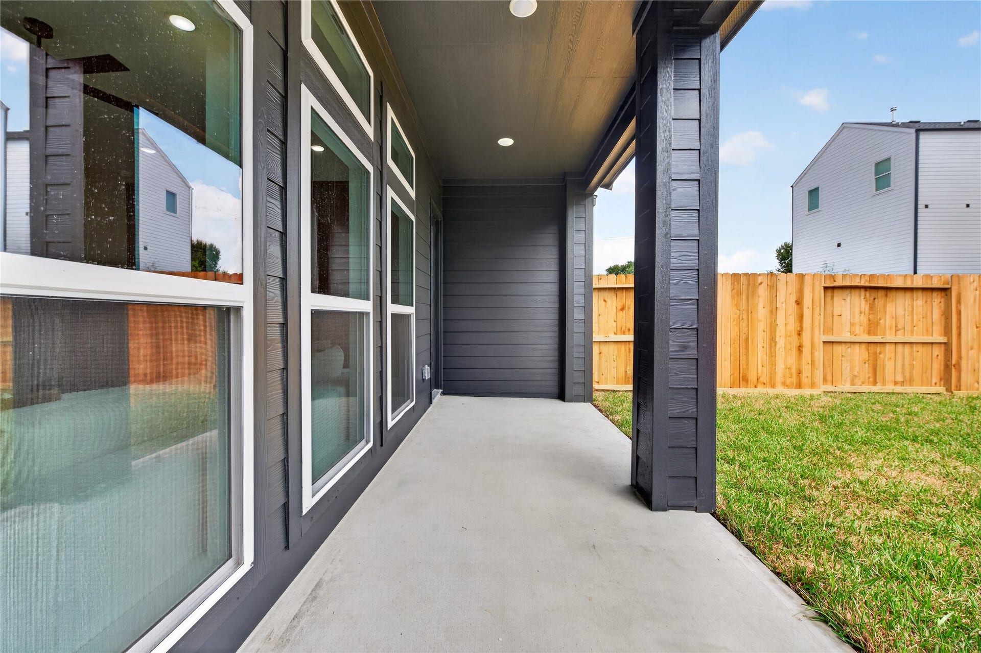 Covered patio lets you enjoy the back yard in any weather.