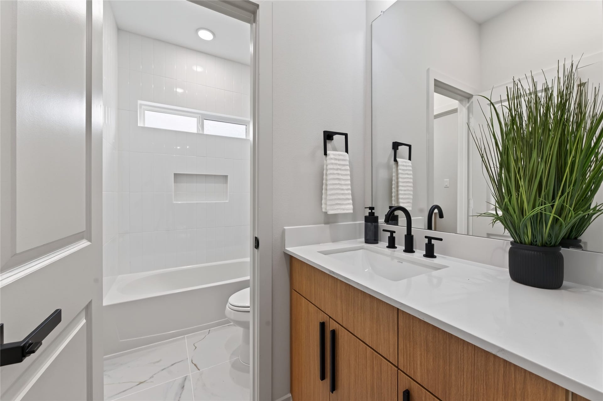 Jack & Jill bathroom with private vanities.