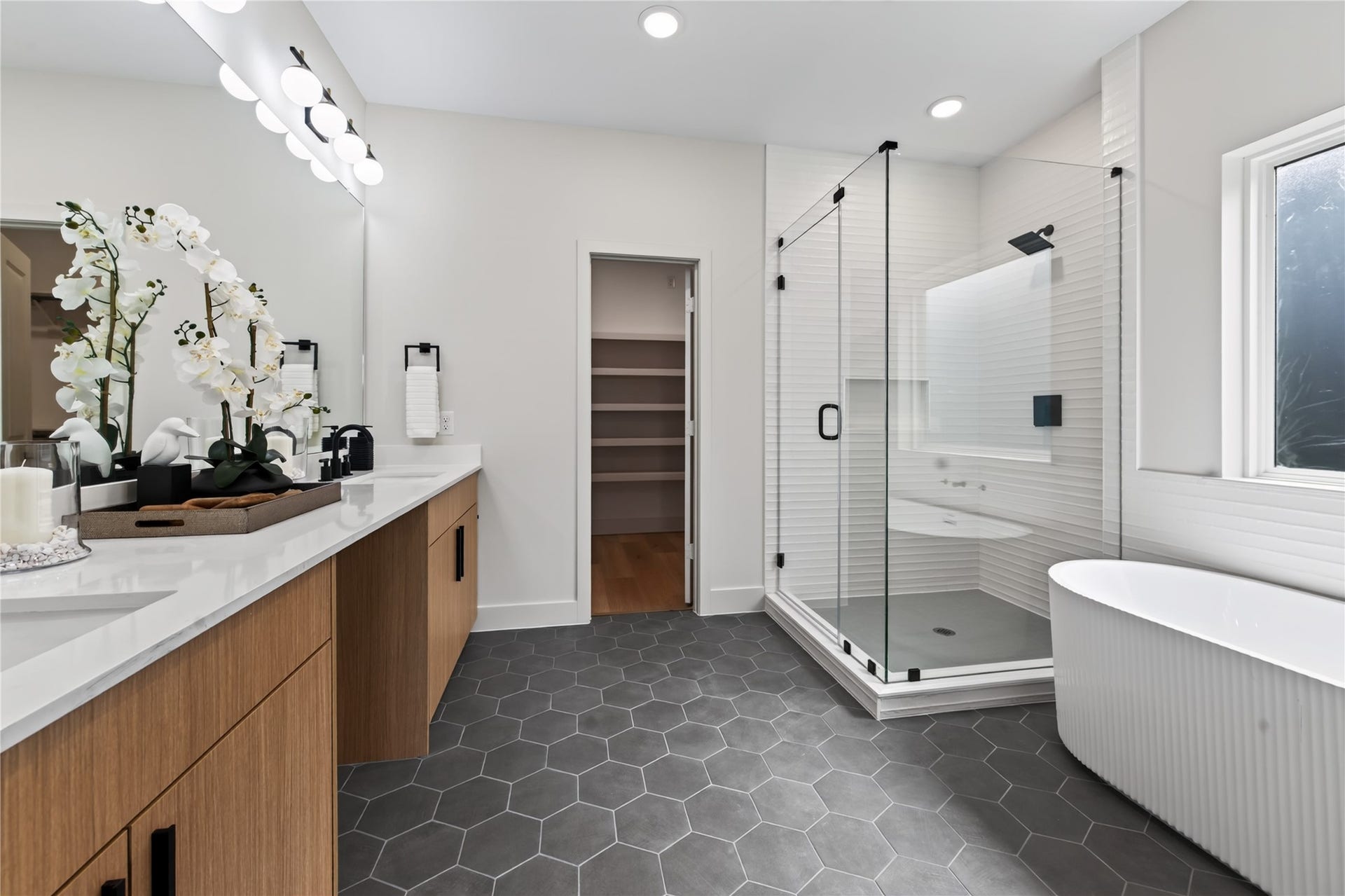 Separate shower & stand alone bath tub let you create your own oasis.