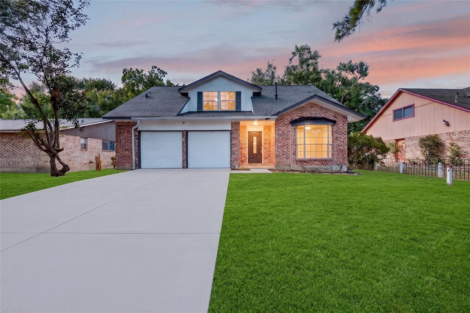 2426 Woodsdale Boulevard, Houston, TX 77038 virtually staged- front yard grass