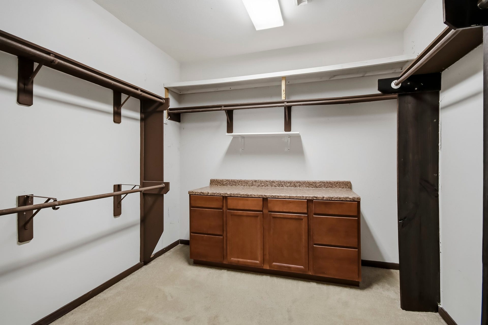 Gorgeous, oversized walk-in closet offering an abundance of space for clothing, shoes, and accessories, with plenty of room to keep everything beautifully organized!
