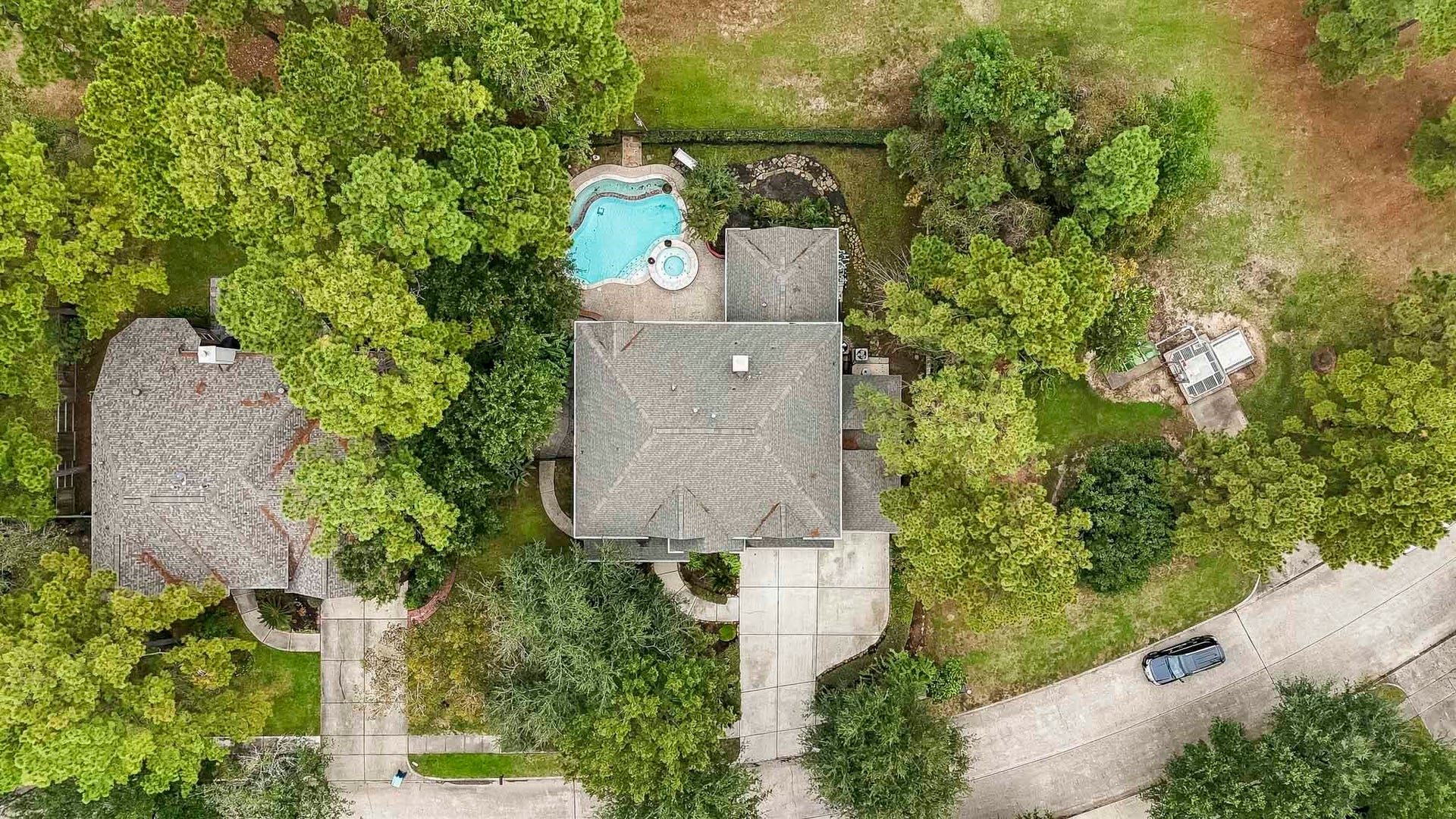 Beautiful birds-eye view of this peaceful neighborhood, where homes are situated on oversized lots surrounded by mature trees, offering exceptional privacy, tranquility, and plenty of room to enjoy!