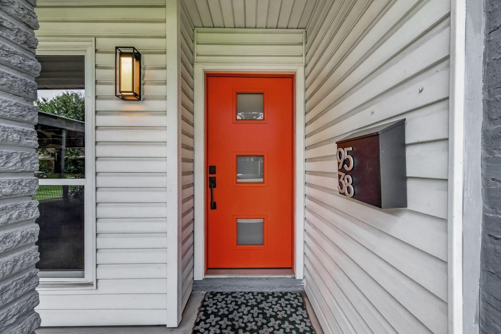 9538 Kerrwood Lane, Houston, TX 77080 The welcoming orange door adds color and whimsy to the clean lines of this home.