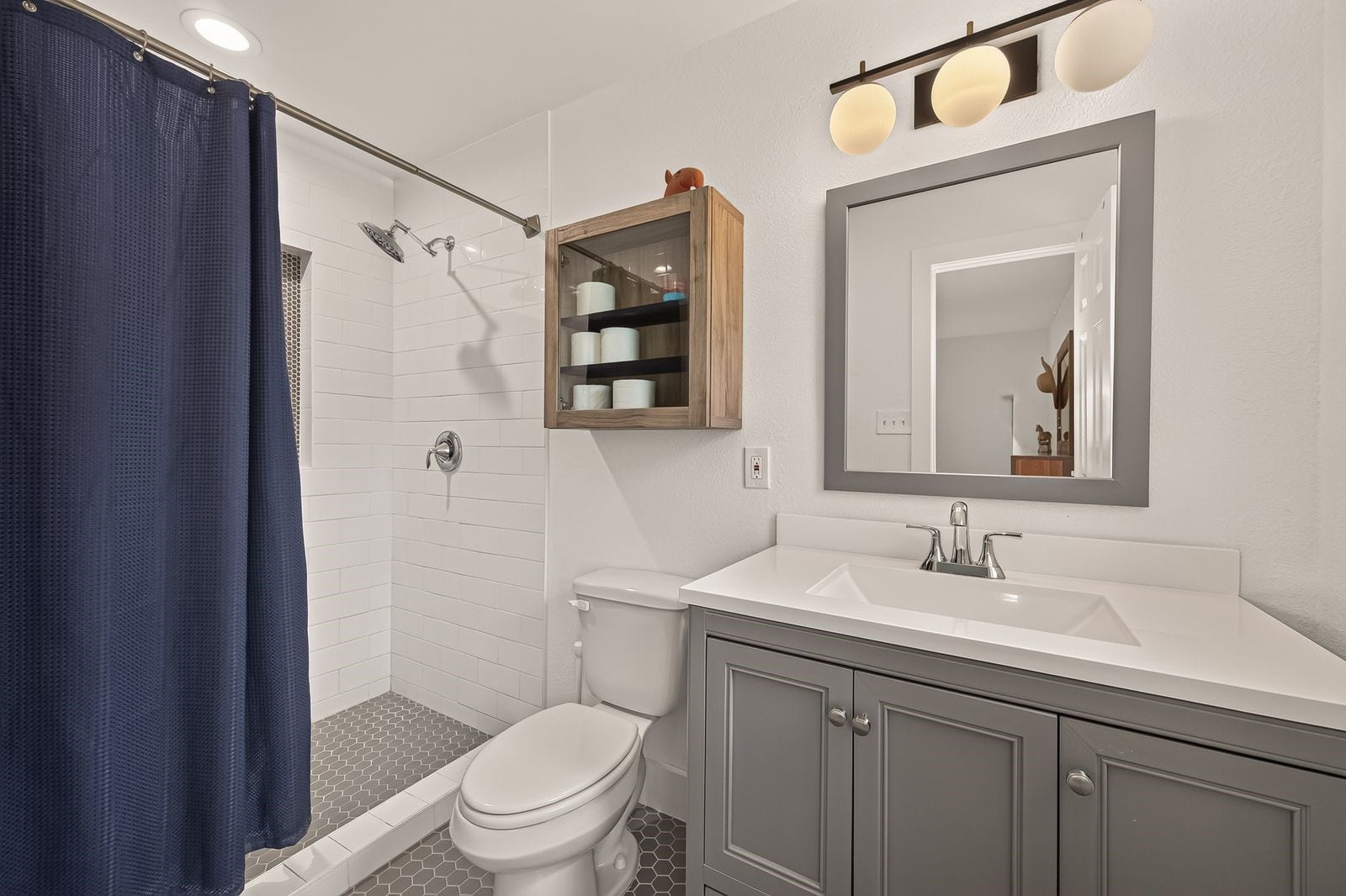 9538 Kerrwood Lane, Houston, TX 77080 The updated primary bath with walk-in shower