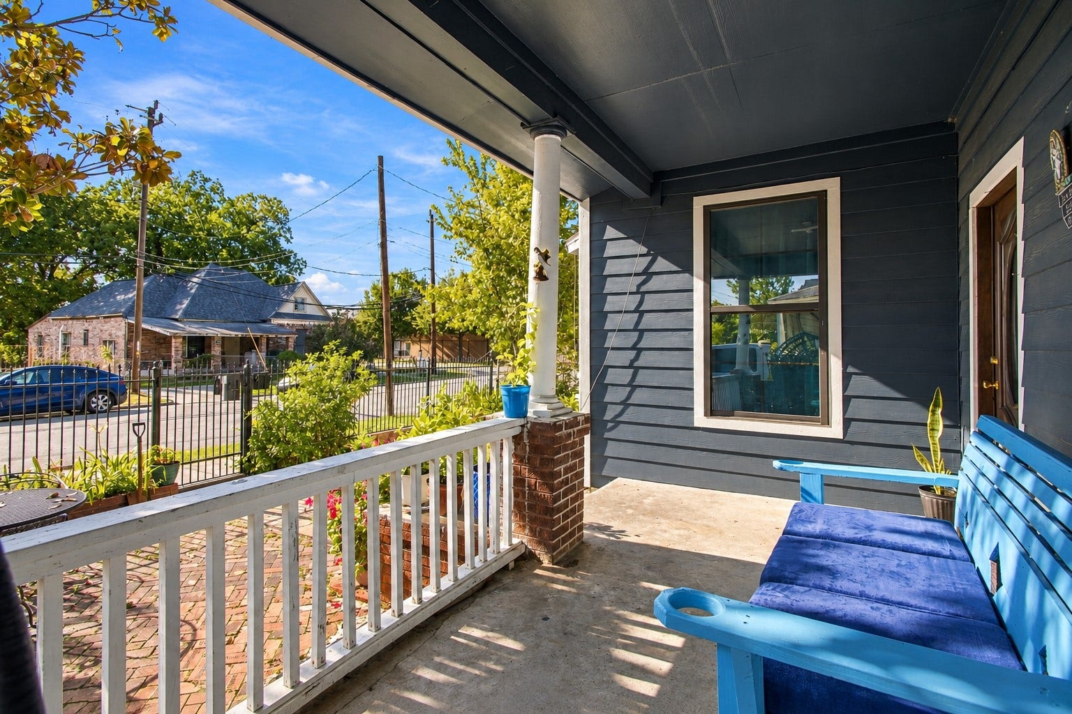 2120 Everett Street, Houston, TX 77009 Covered front porch with seating and views of the front yard.