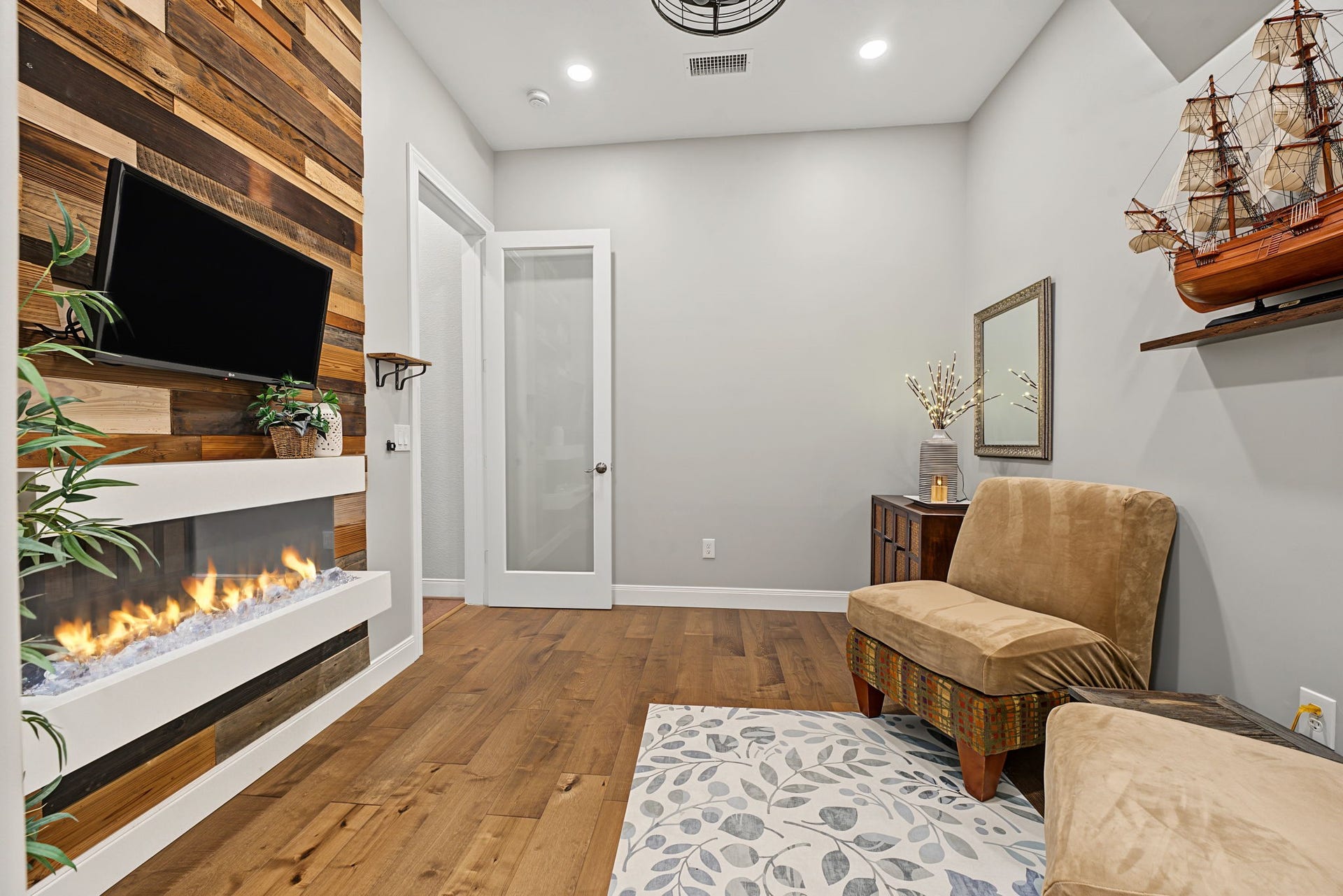 229 Percheron Drive, Spring, TX 77382 The bonus flex room has a private door, electric fireplace (color-changing!), full climate control, and recessed lighting.