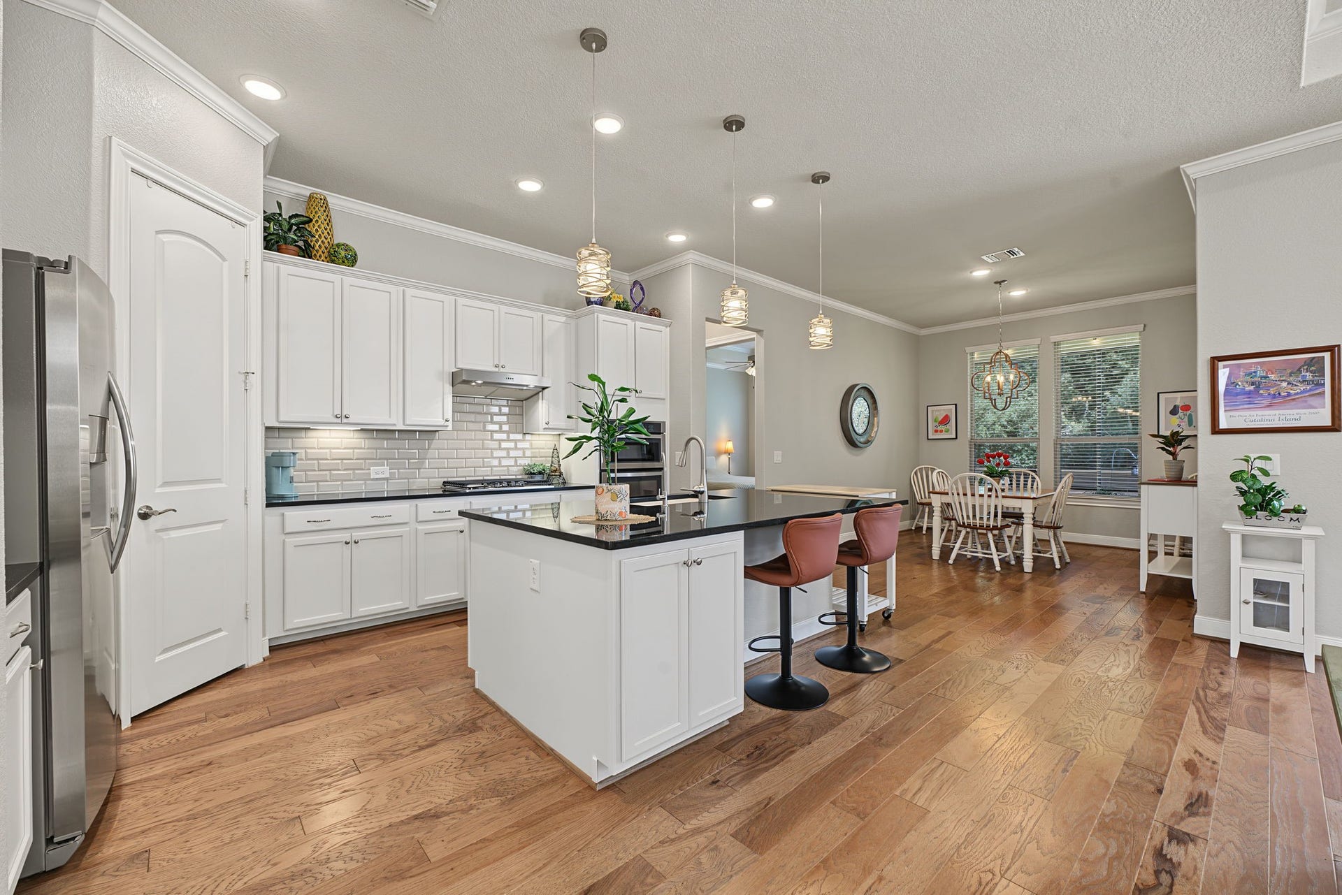 229 Percheron Drive, Spring, TX 77382 The Breakfast Room is in the rear with views out to the tree preserve.