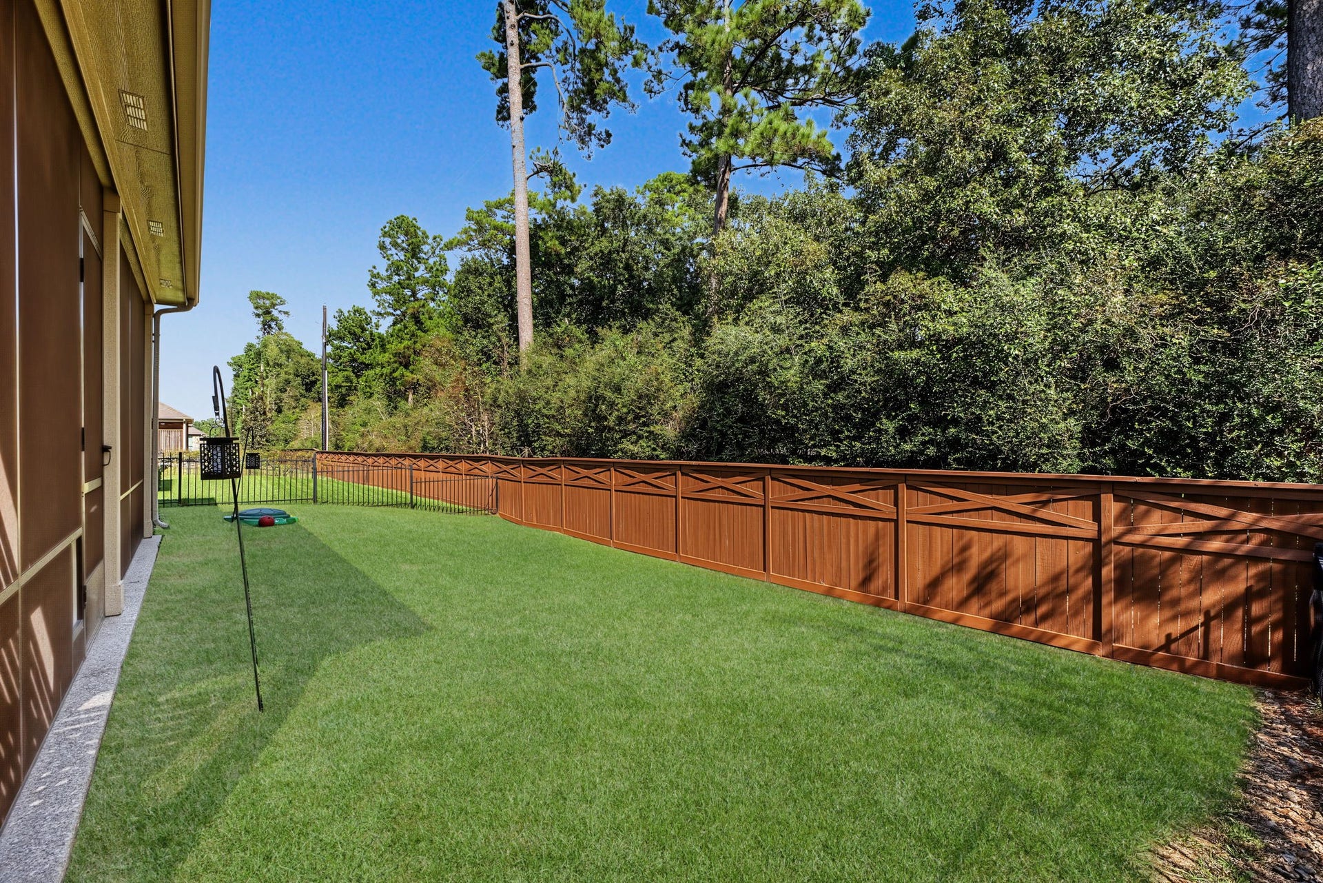 229 Percheron Drive, Spring, TX 77382 The backyard has good grass space, and easily manageable too. Full sprinkler system. No rear neighbors other than the birds in the trees.