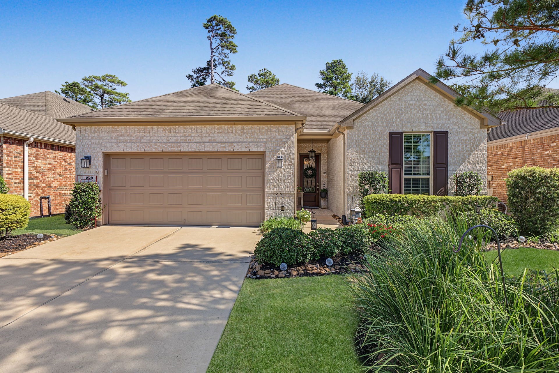 229 Percheron Drive, Spring, TX 77382 Full gutters all the way around, an updated irrigation system (Rain Bird), and established landscaping.