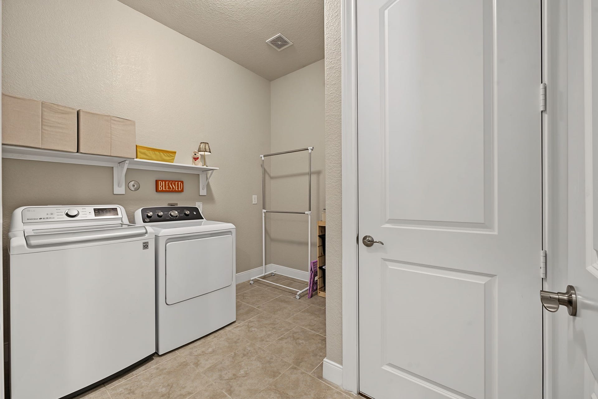 229 Percheron Drive, Spring, TX 77382 Spacious laundry room with extra space available for a fridge or storage. Mechanicals to HVAC are in that closet.