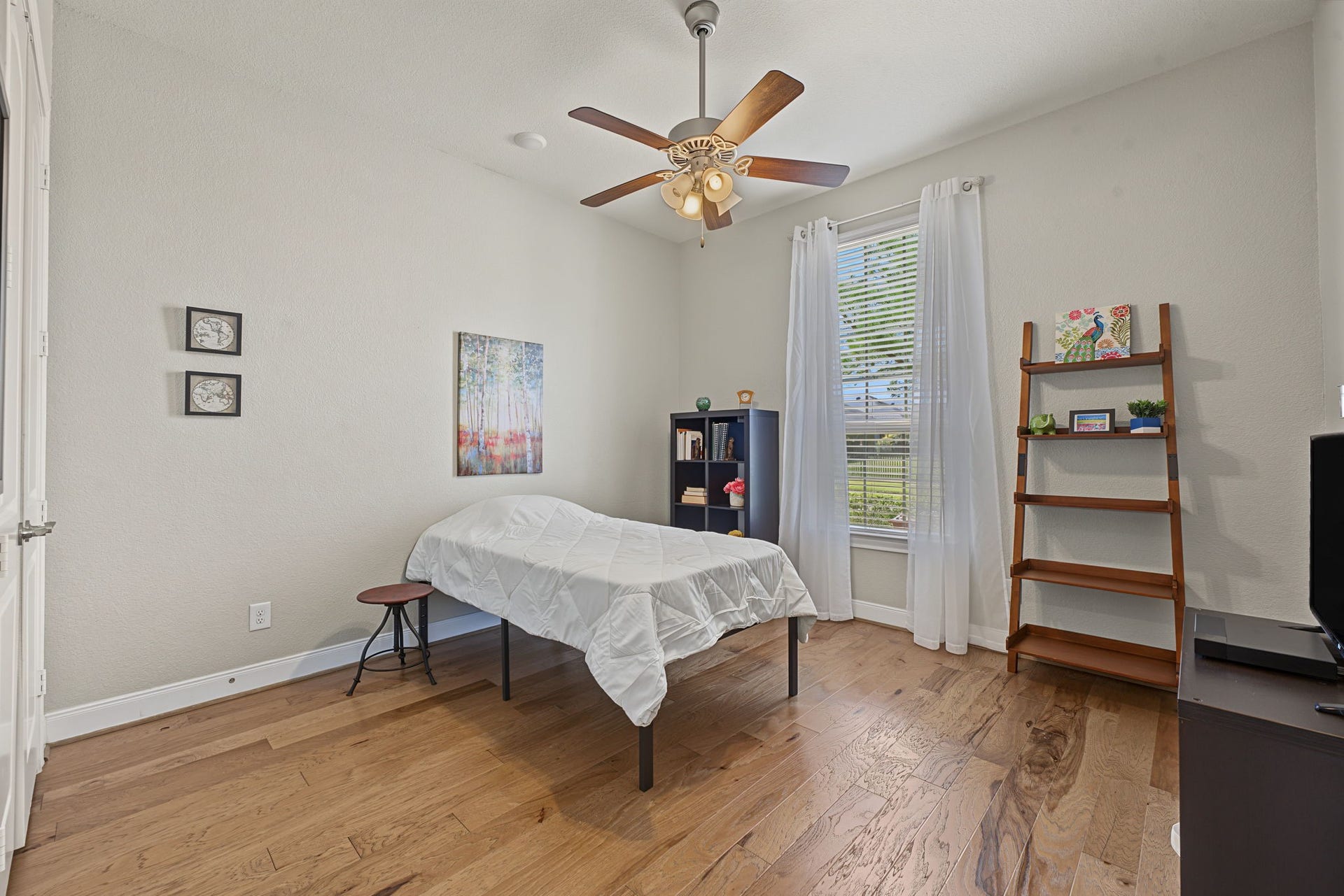 229 Percheron Drive, Spring, TX 77382 Bedroom #2 is at the front of the home completely separated away from the rear primary suite. Bedroom #2 is approx 12.6' x 12'.