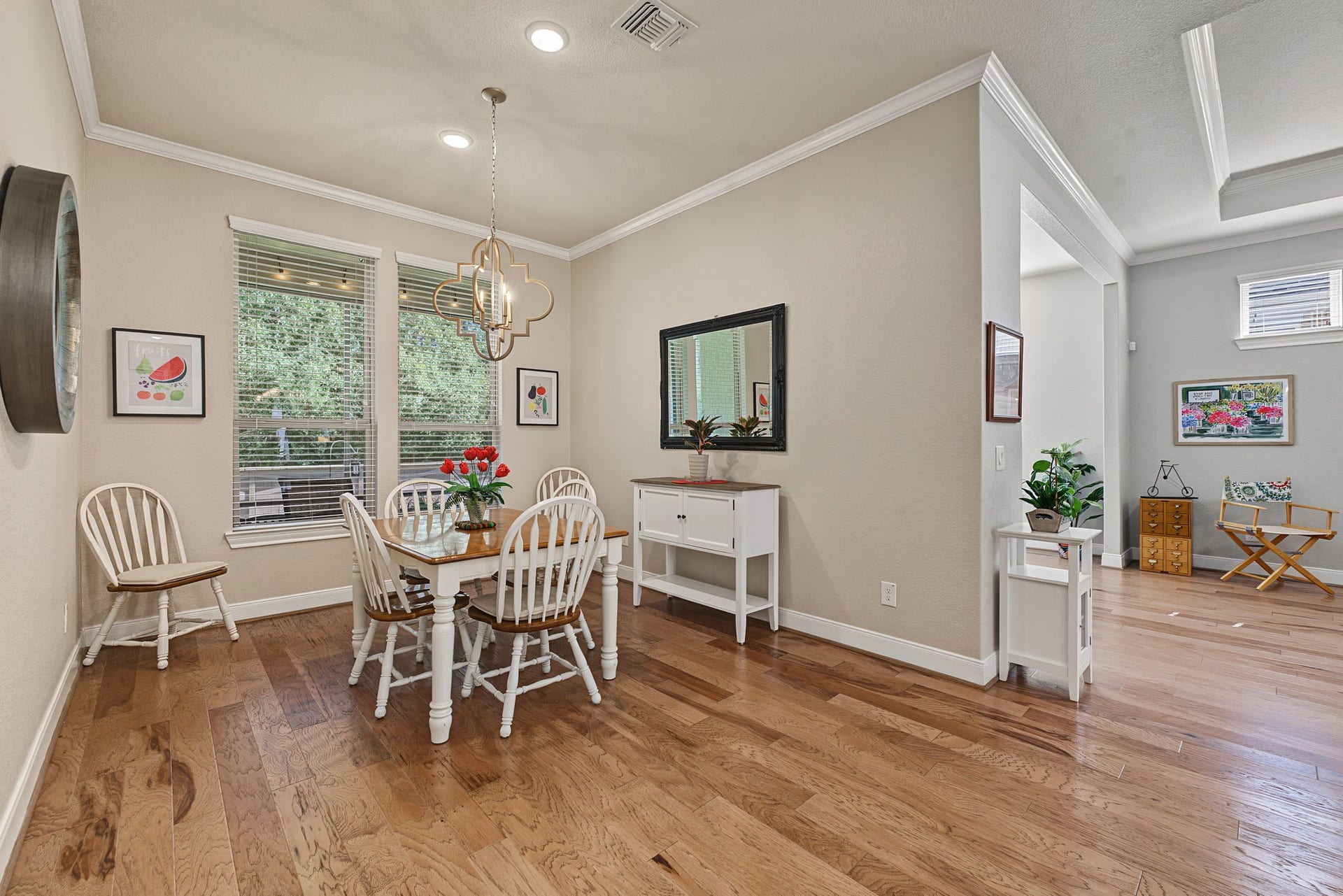 229 Percheron Drive, Spring, TX 77382 Open to the kitchen and family room, the spacious breakfast area feels like its own distinct space, with a peaceful view of the trees behind the home.