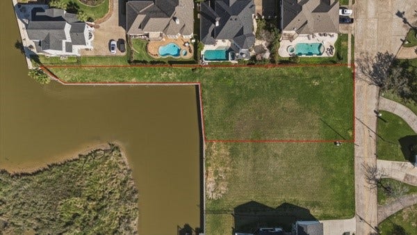 923 Davis Road, League City, TX 77573 Includes long piece of land that goes behind the neighbors