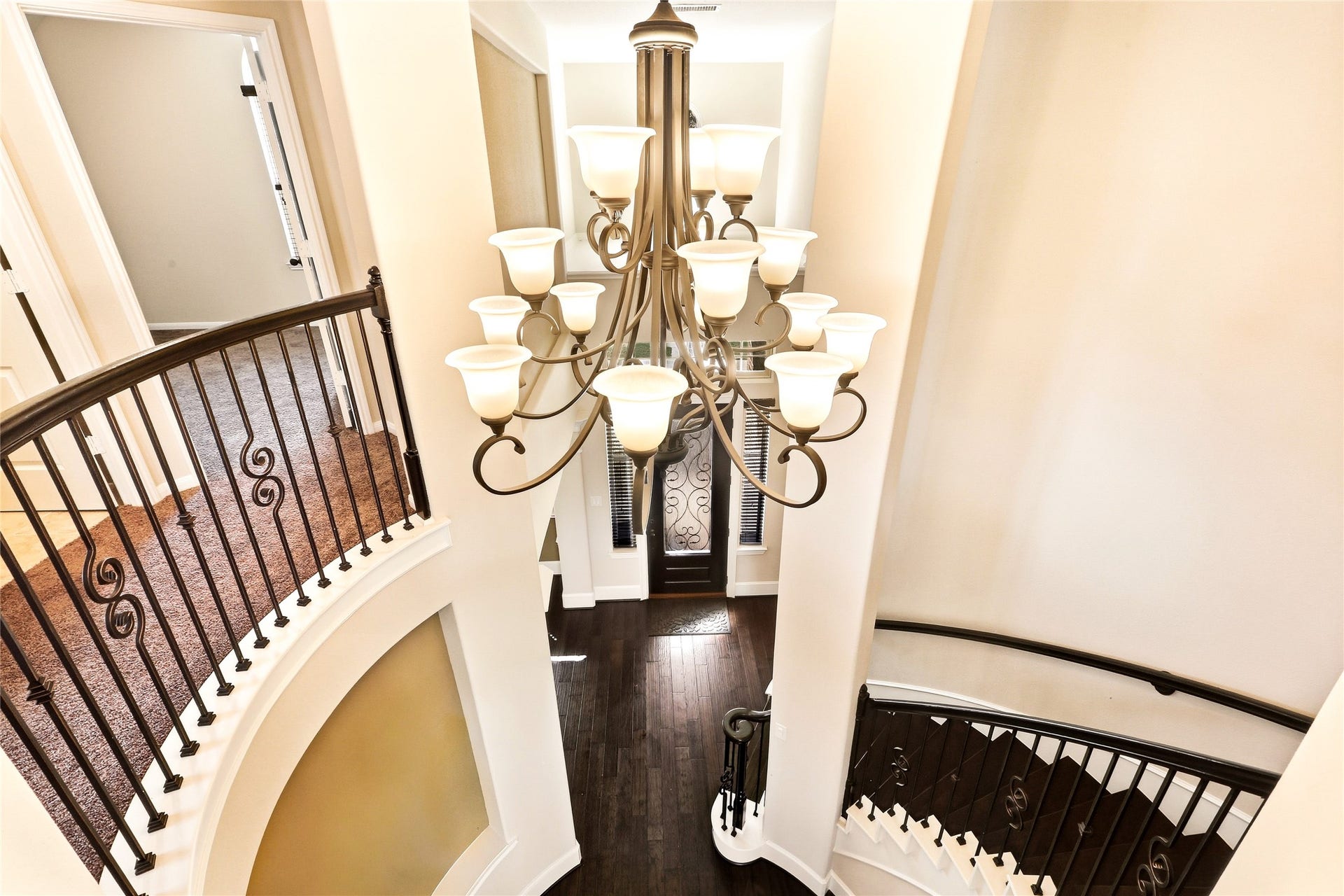 Grand spiral staircase overlooking foyer