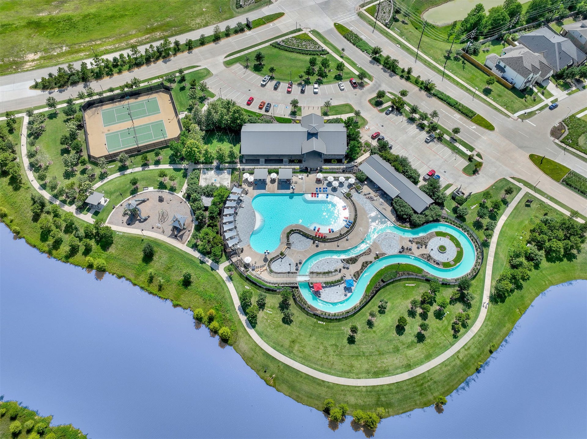 lazy river, resort pool, tennis courts, fitness center and playgrounds located at the SHED