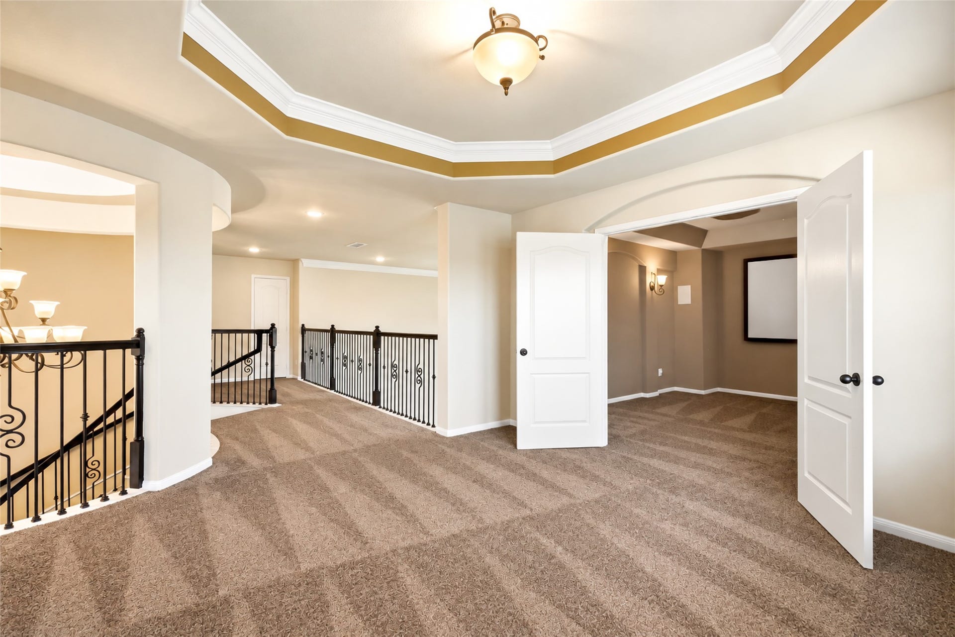 Tray ceiling accents this space that can be used as gameroom or second living space
