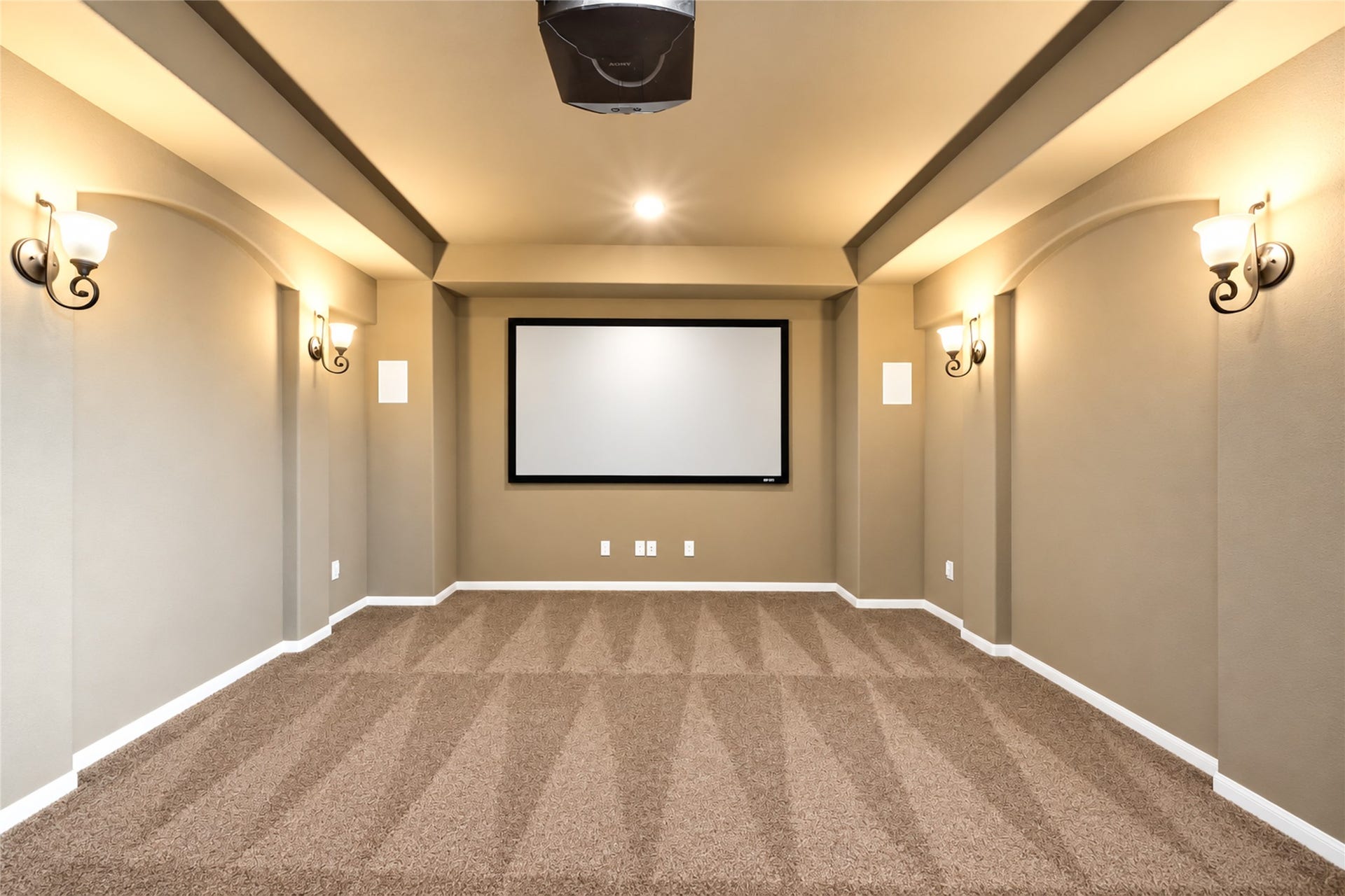 Upgraded carpet in theater room along with light sconces, theater screen and projector, all included!