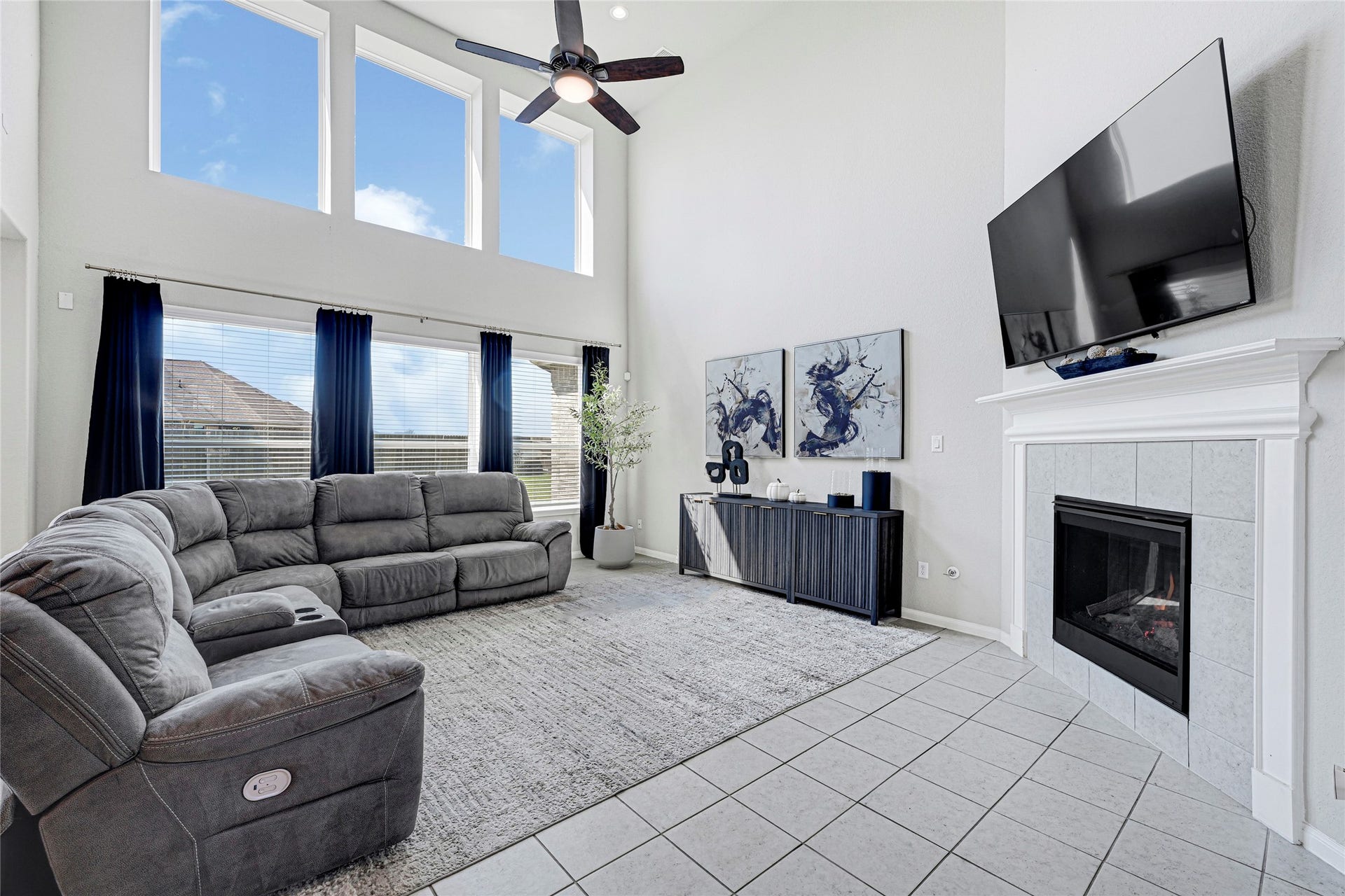 Grand & Light-filled Family Room with Gas Fireplace.
