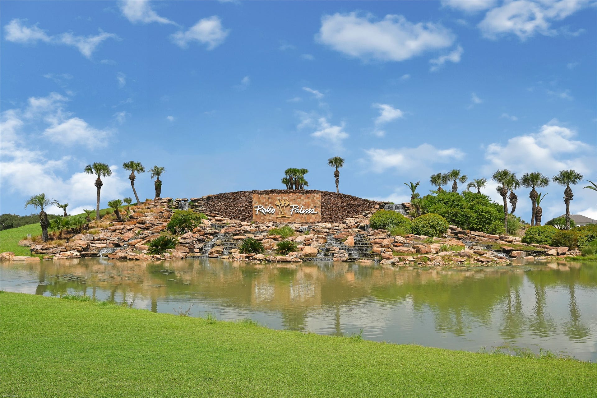 Rodeo Palms Monument with Waterfall at Entrance of 288