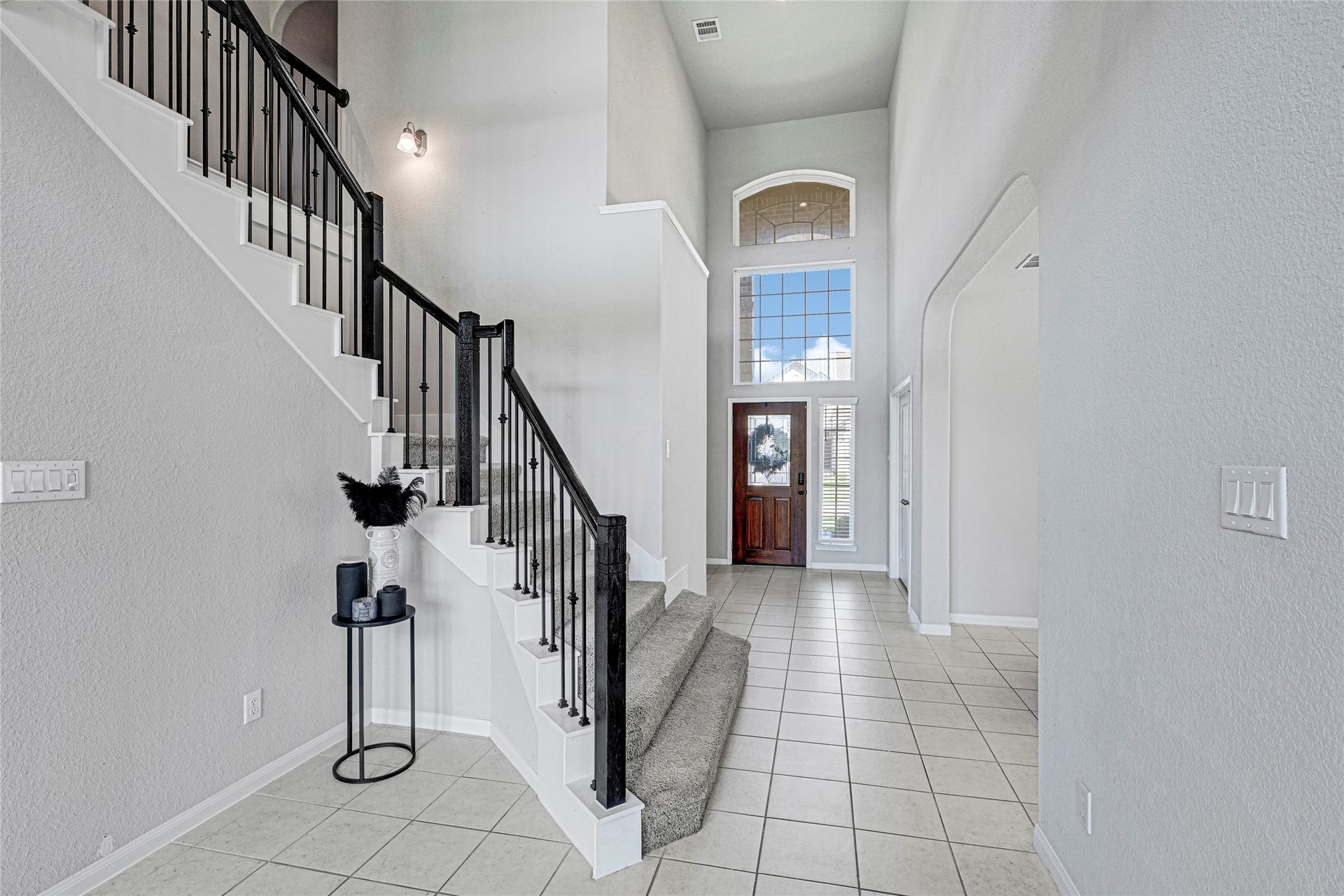Grand Staircase with Wrought Iron Railings.