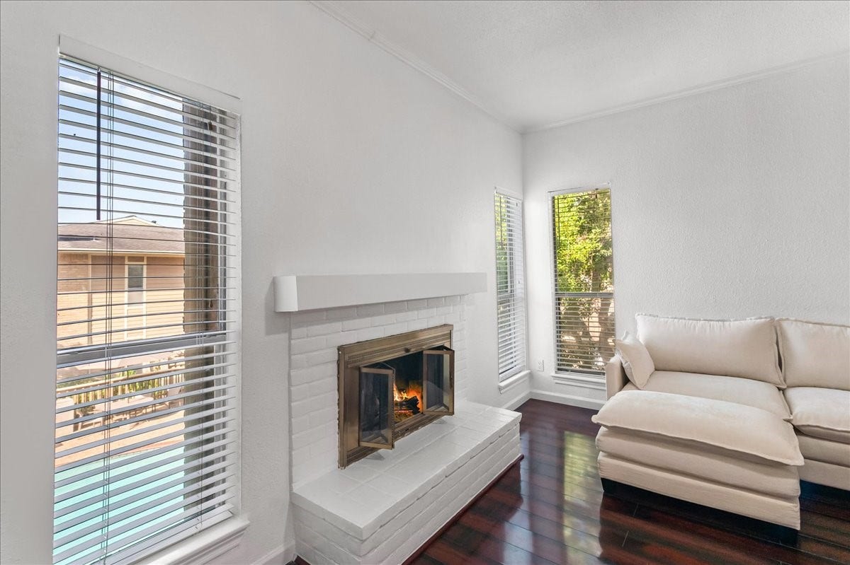 Lots of natural light, with views of mature trees and the pool