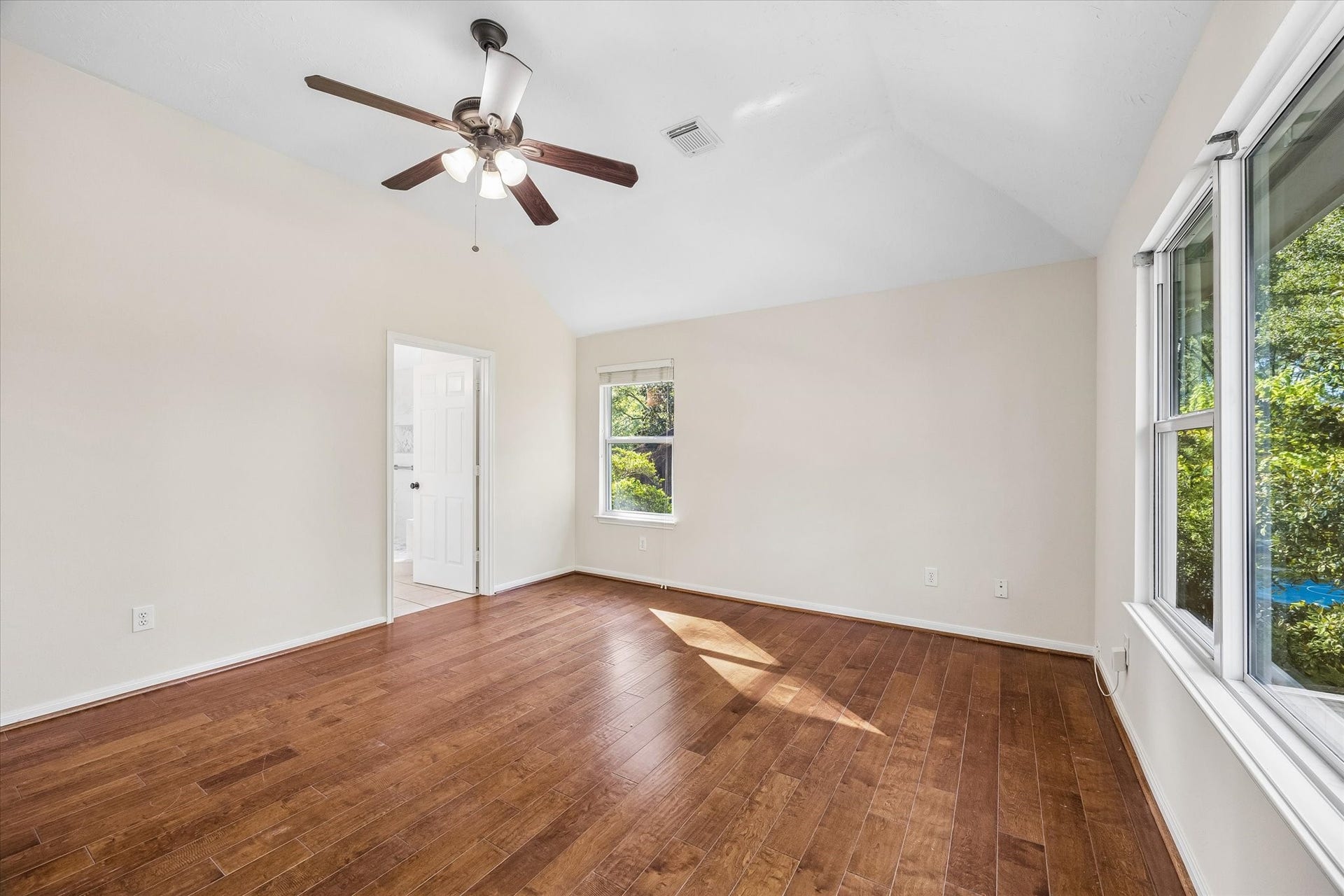 11 Merryvale Drive, The Woodlands, TX 77382 Another view of the second-level primary suite showcasing the vaulted ceilings The en-suite bathroom adds convenience to this spacious retreat.