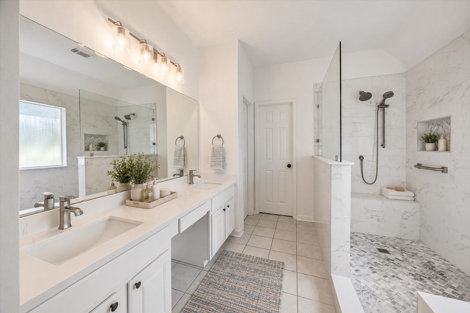 11 Merryvale Drive, The Woodlands, TX 77382 The spacious primary en-suite bathroom has been completely renovated. It features a modern feel with a dual-sink vanity, sleek countertops, and oversized mirrors, creating a clean and polished space. Virtually staged with accessories.