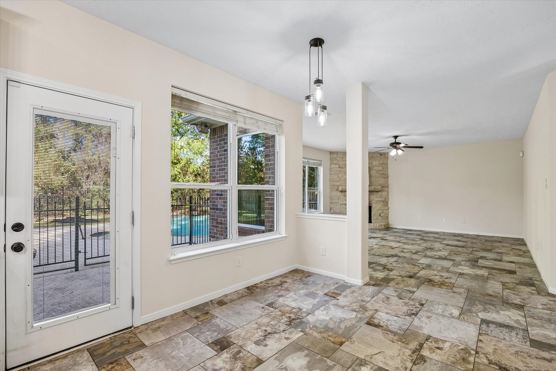11 Merryvale Drive, The Woodlands, TX 77382 The breakfast area is conveniently located just off the kitchen, with large windows overlooking the backyard and pool!