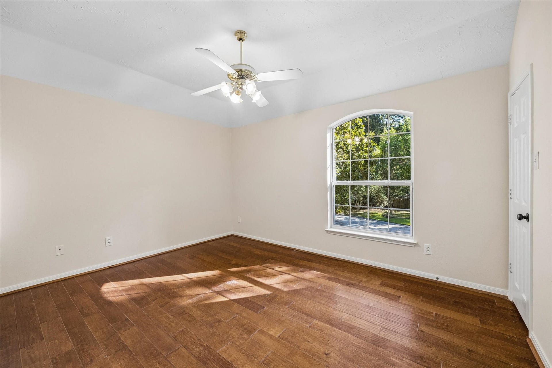 11 Merryvale Drive, The Woodlands, TX 77382 One of the three secondary bedrooms upstairs, featuring a walk-in closet and abundant natural light!