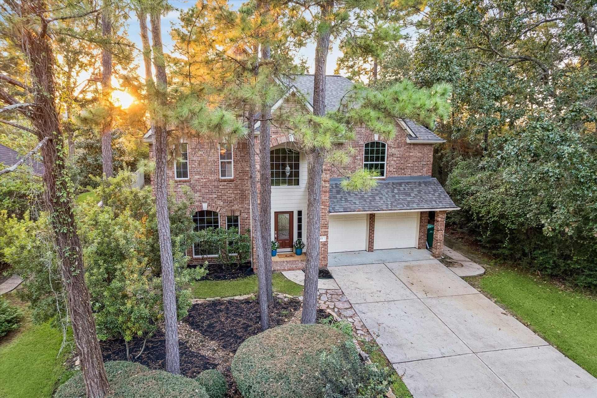 11 Merryvale Drive, The Woodlands, TX 77382 Mature trees surround the home, adding natural beauty, shade, and a sense of privacy.