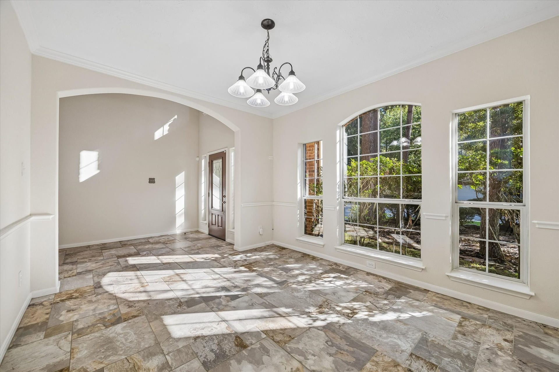 11 Merryvale Drive, The Woodlands, TX 77382 Another view of the formal dining room highlighting expansive windows that fill the space with abundant natural light. Nearly all windows have been replaced and are double paned.