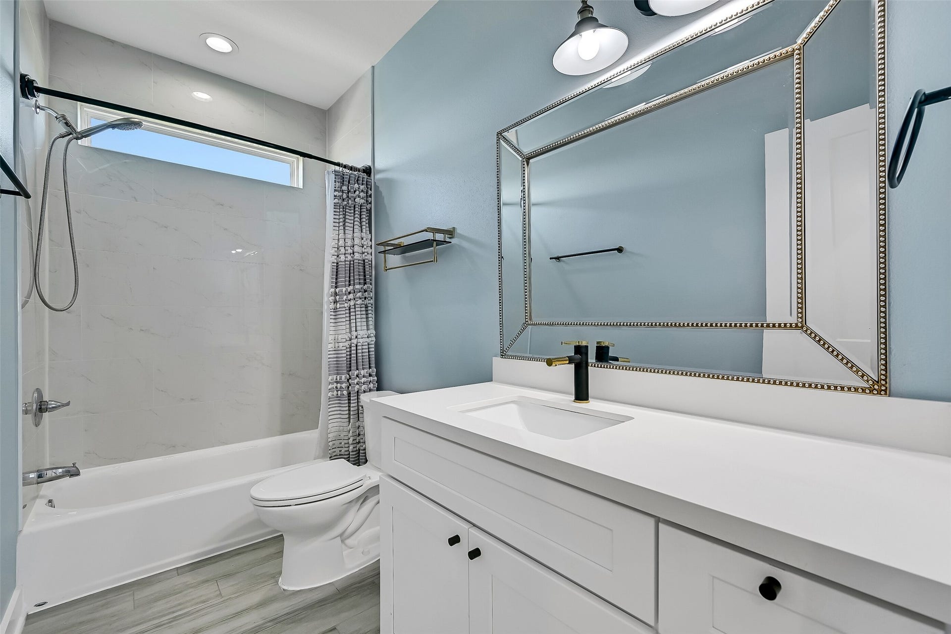 3911 Warrior Court, Galveston, TX 77554 A full bathroom can be found in the hall between the guest bedrooms.