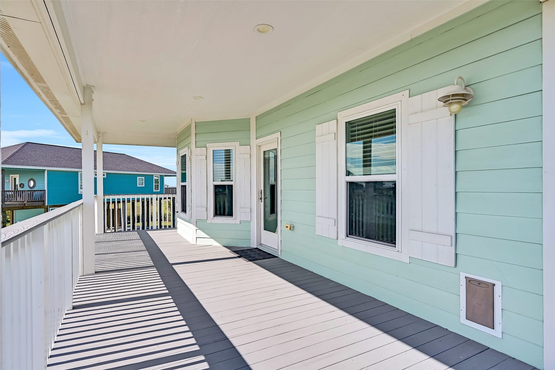 3911 Warrior Court, Galveston, TX 77554 The spacious deck offers plenty of room to unwind while taking in the gorgeous sunsets.