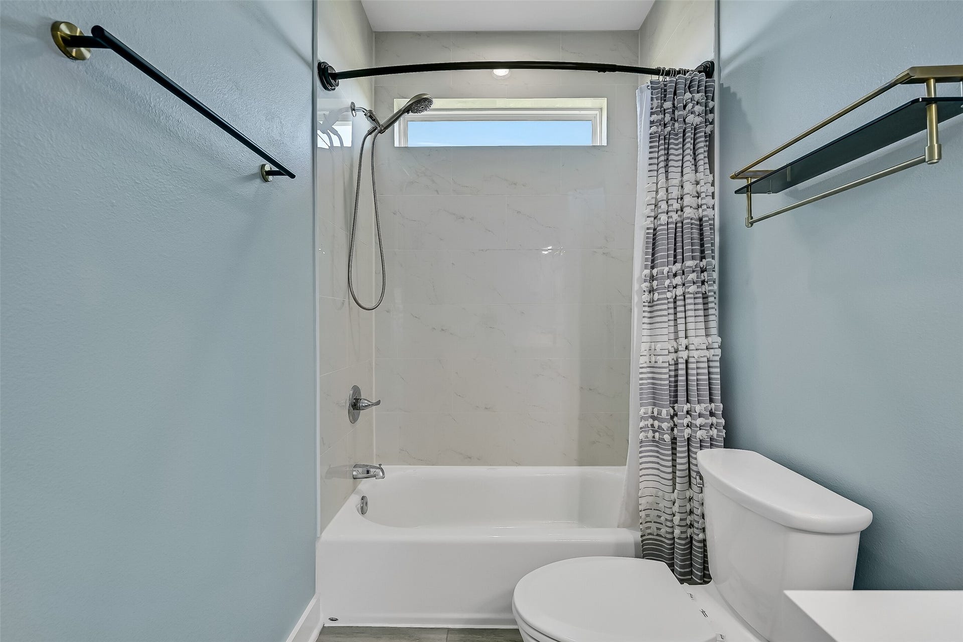 3911 Warrior Court, Galveston, TX 77554 The bathroom offers a tub/shower combo.