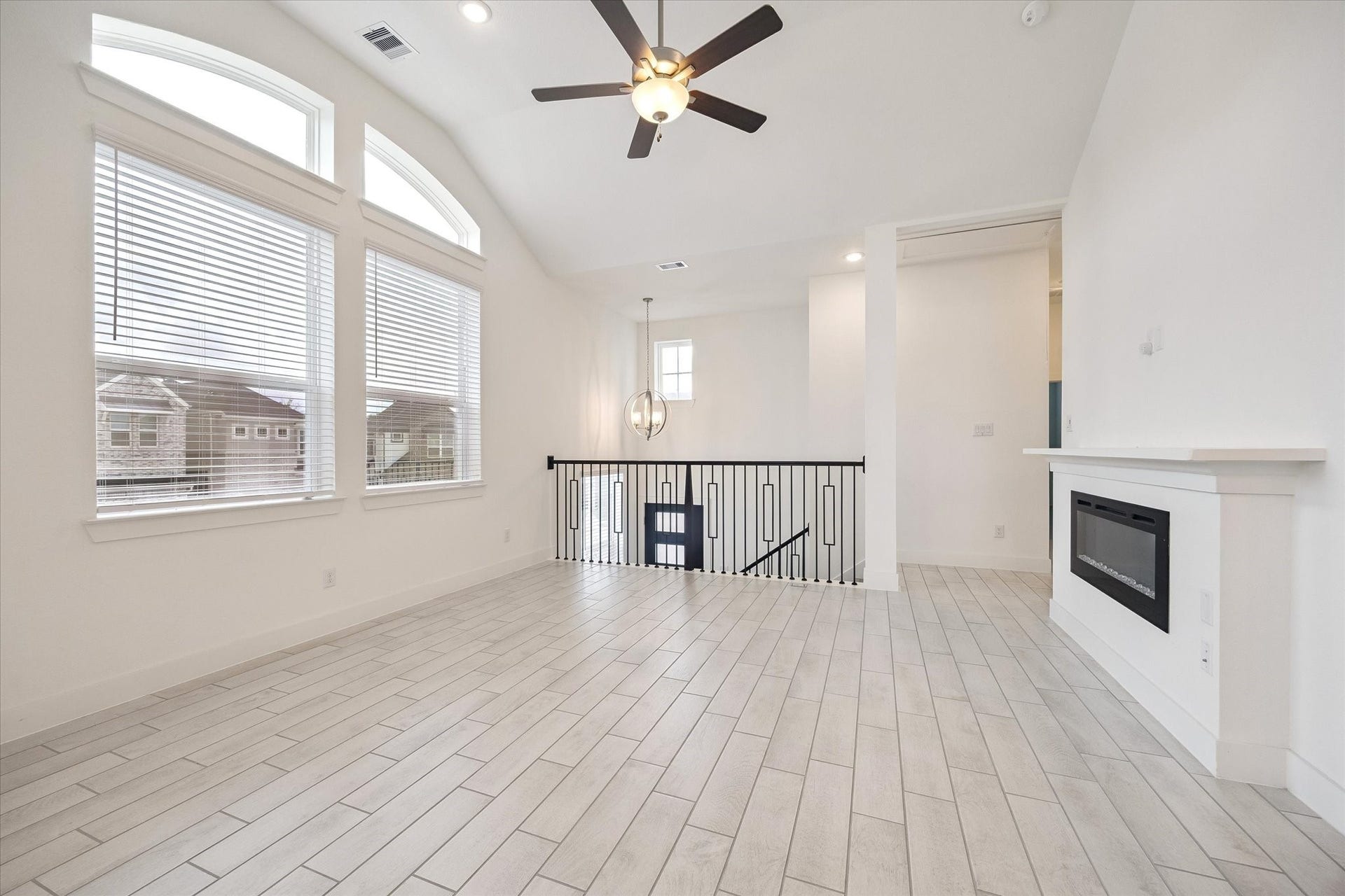 2814 Park Hill Drive, Stafford, TX 77477 High end glass fire place, large windows left in abundant lights