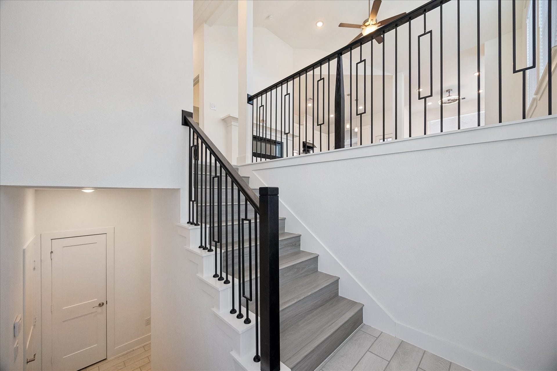 2814 Park Hill Drive, Stafford, TX 77477 Beautiful staircases lead to 2nd floor living, kitchen, dining and primary suite