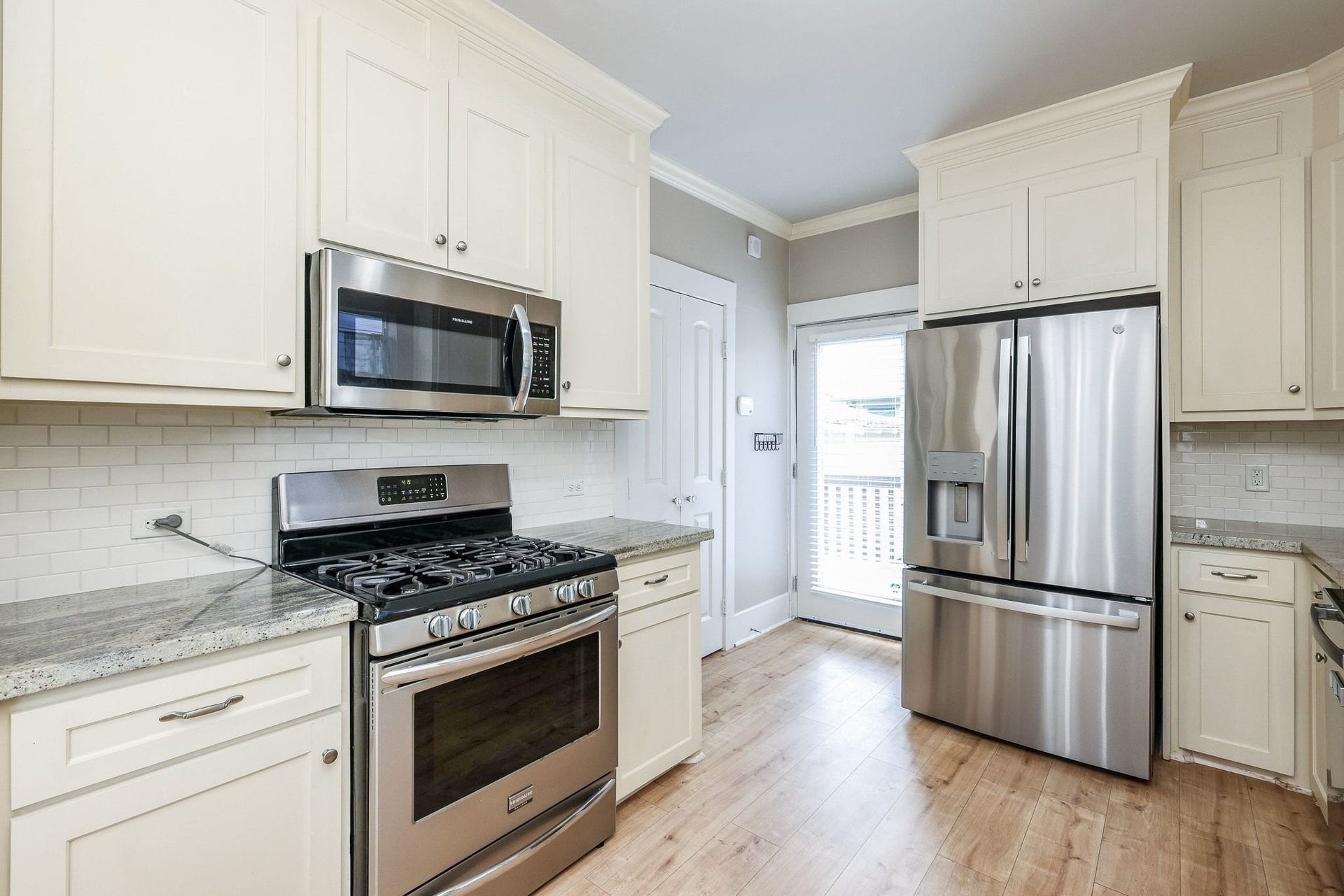 1307 Walton Street, Houston, TX 77009 This kitchen has tons of natural light with this perfect situated back door.