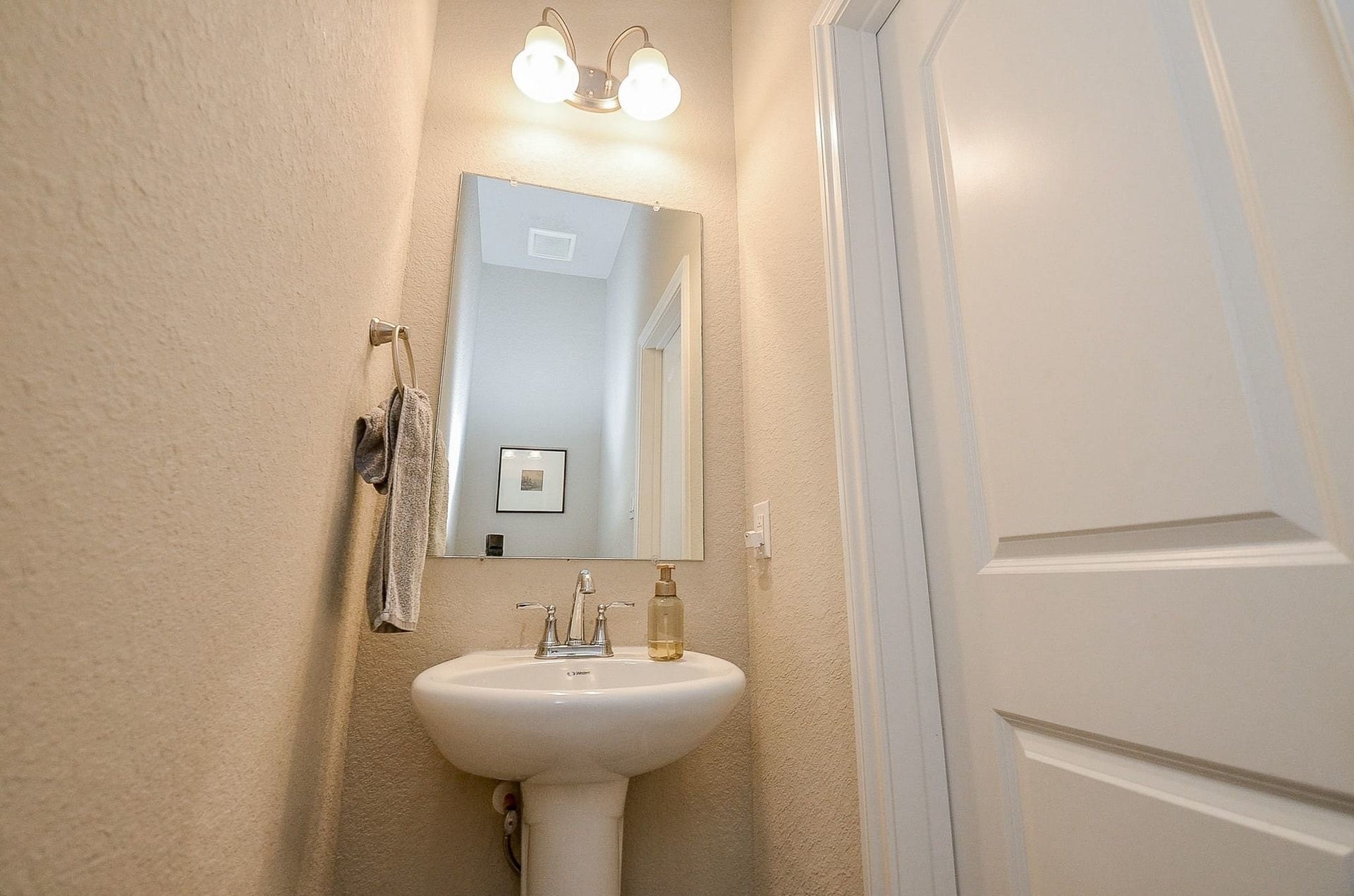 5146 Prairie Terrace Lane, Fulshear, TX 77441 On the first floor there is a half bathroom for guests