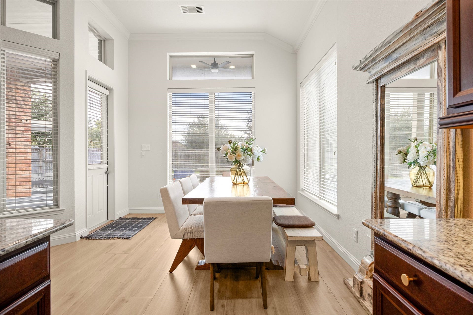 9612 Eden Ridge Lane, Pearland, TX 77584 BREAKFAST AREA Light-filled breakfast area surrounded by windows with views of the backyard and pool