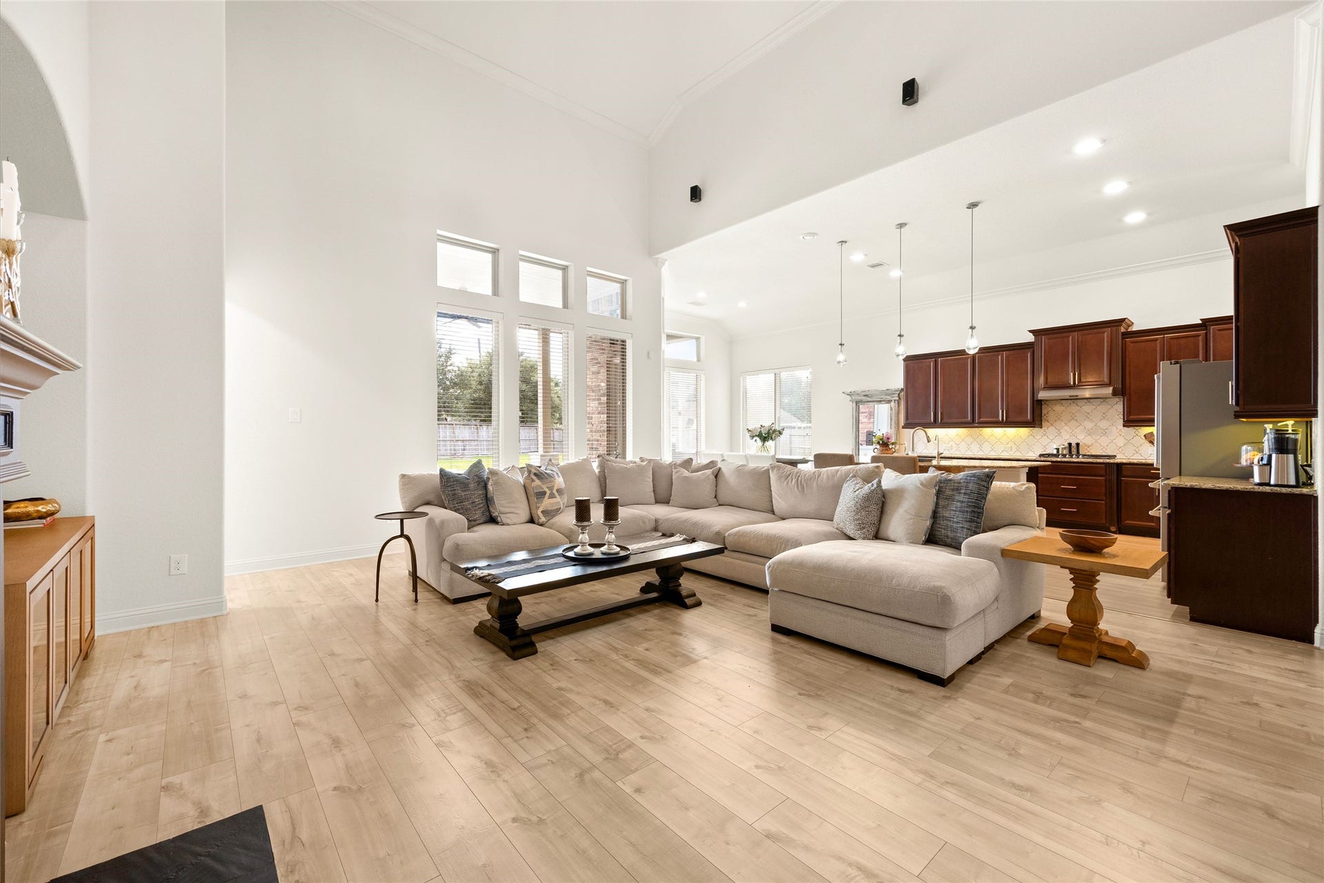 9612 Eden Ridge Lane, Pearland, TX 77584 LIVING ROOM III Open-concept living room showcasing the seamless flow into the kitchen and breakfast area, ideal for everyday living and entertaining.