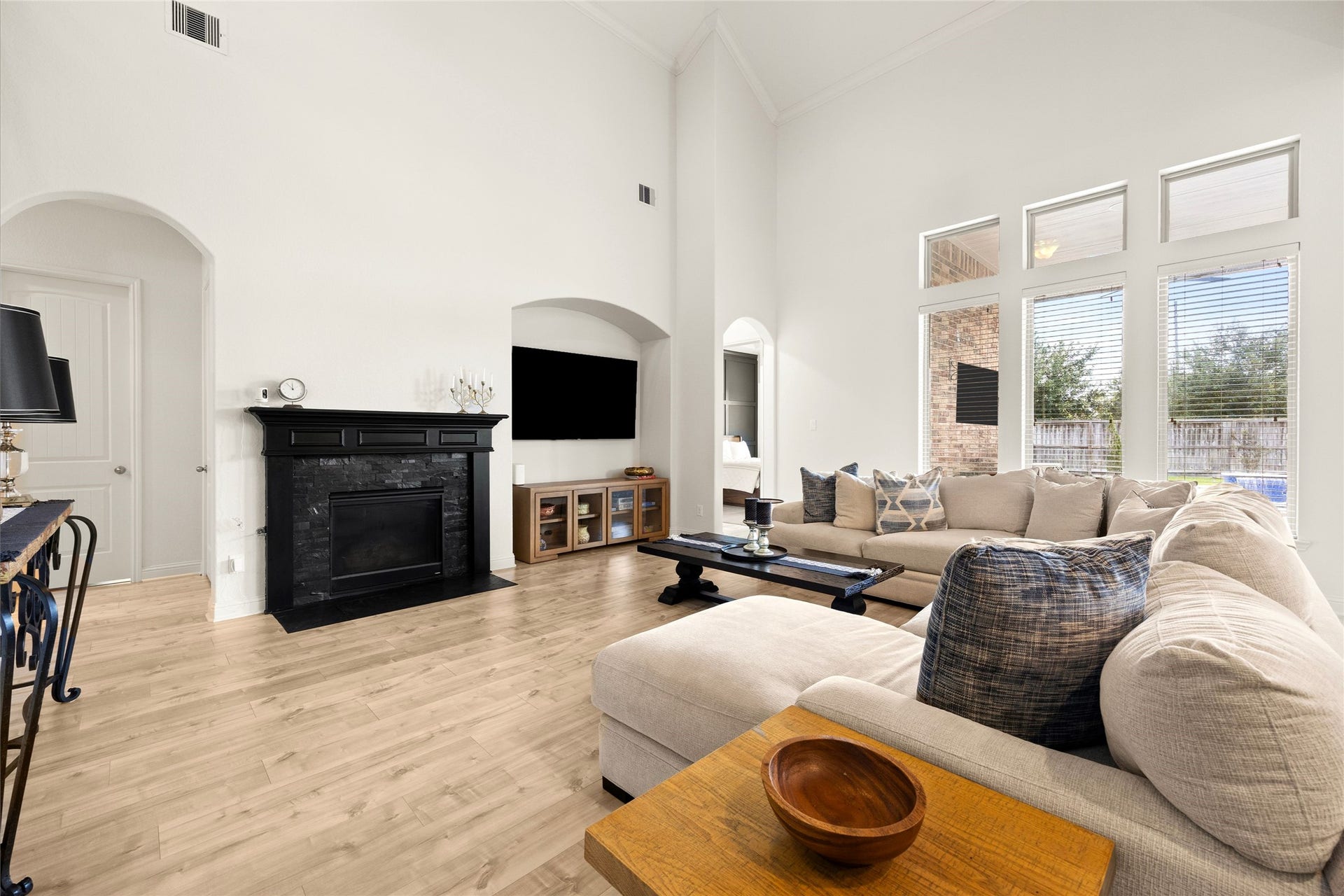 9612 Eden Ridge Lane, Pearland, TX 77584 LIVING ROOM II Another perspective of the spacious living room and expansive windows overlooking the backyard and pool.