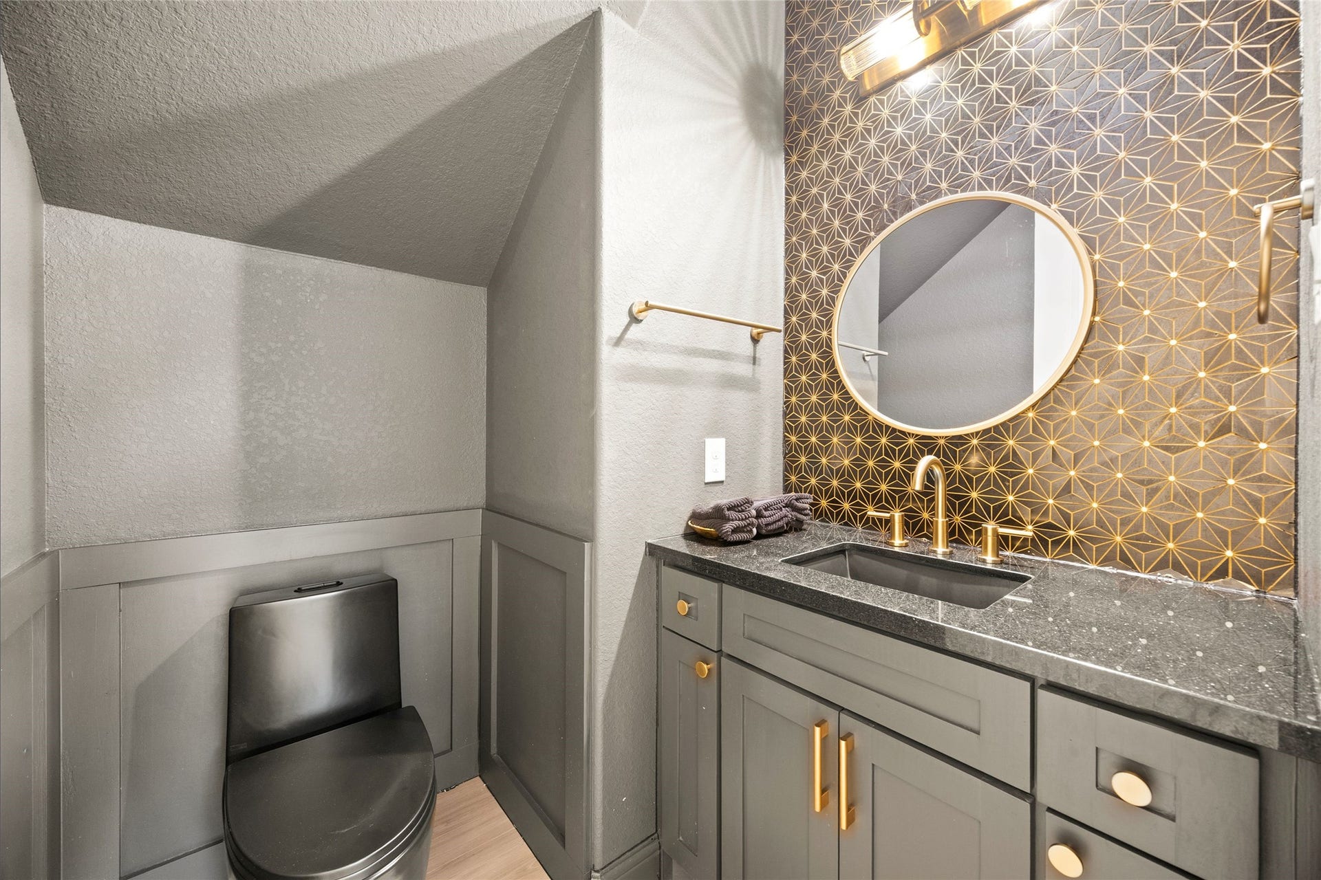 9612 Eden Ridge Lane, Pearland, TX 77584 POWDER ROOM Stylishly updated powder room featuring a statement accent wall, modern vanity.