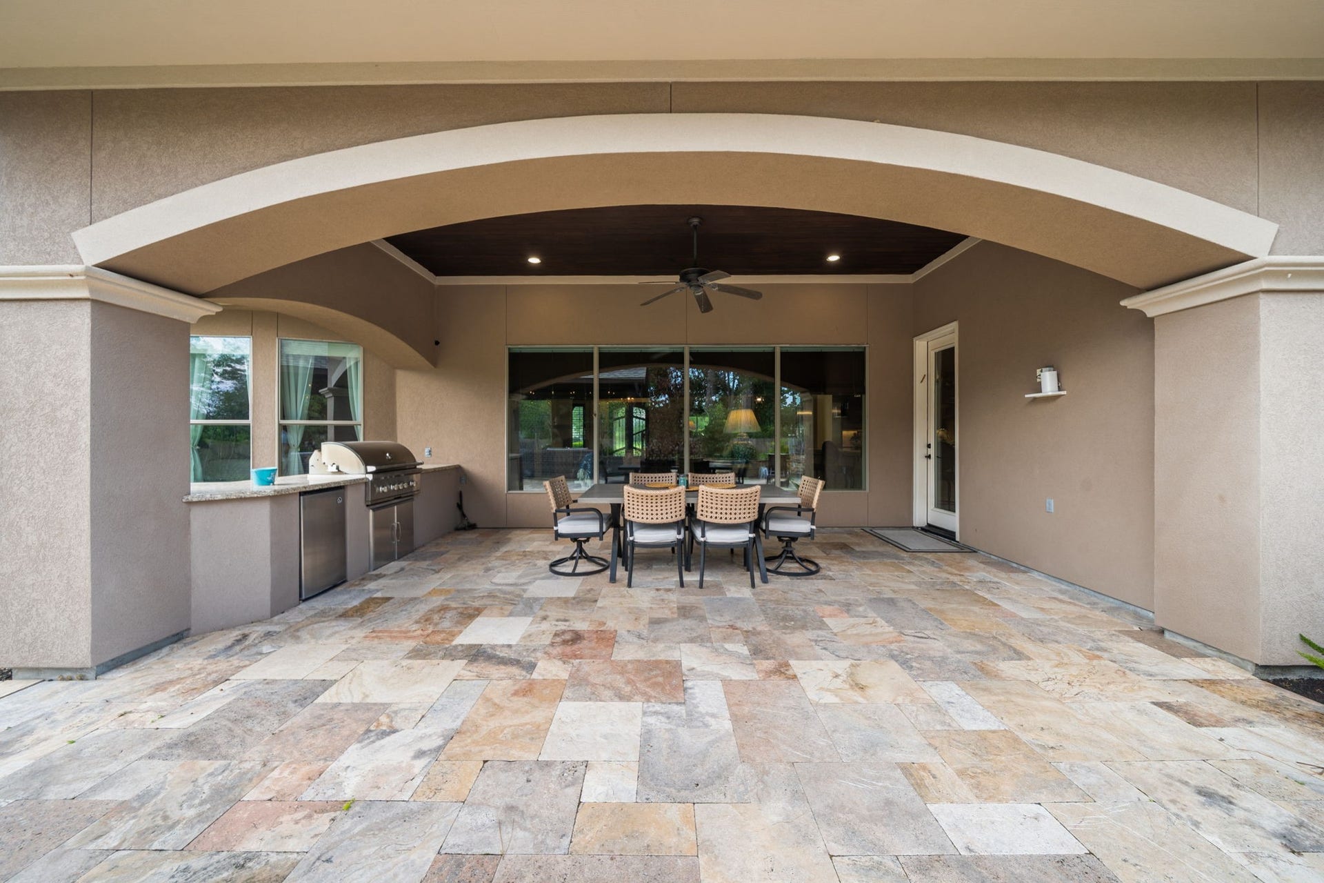 4426 Silver Jade Drive, Spring, TX 77386 This huge covered back patio is a grill masters dream. The fully equipped outdoor kitchen features a premium built-in grill, a handy mini-fridge, and extensive granite countertop space for easy meal prep.