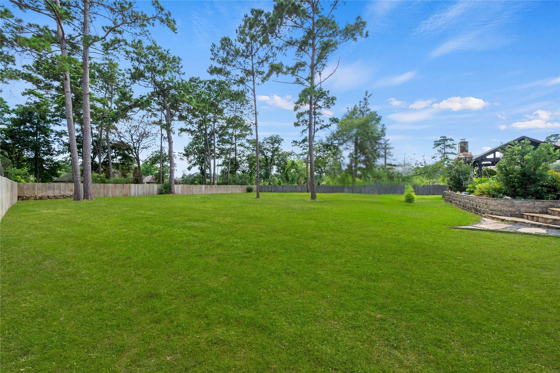 4426 Silver Jade Drive, Spring, TX 77386 A magnificent outdoor footprint of rare scale. This massive greenbelt offers unprecedented backyard versatility that is nearly impossible to replicate, easily accommodating a playground, a formal private garden, or a sprawling emerald lawn, all while preserving an unmatched sense of privacy and space.
