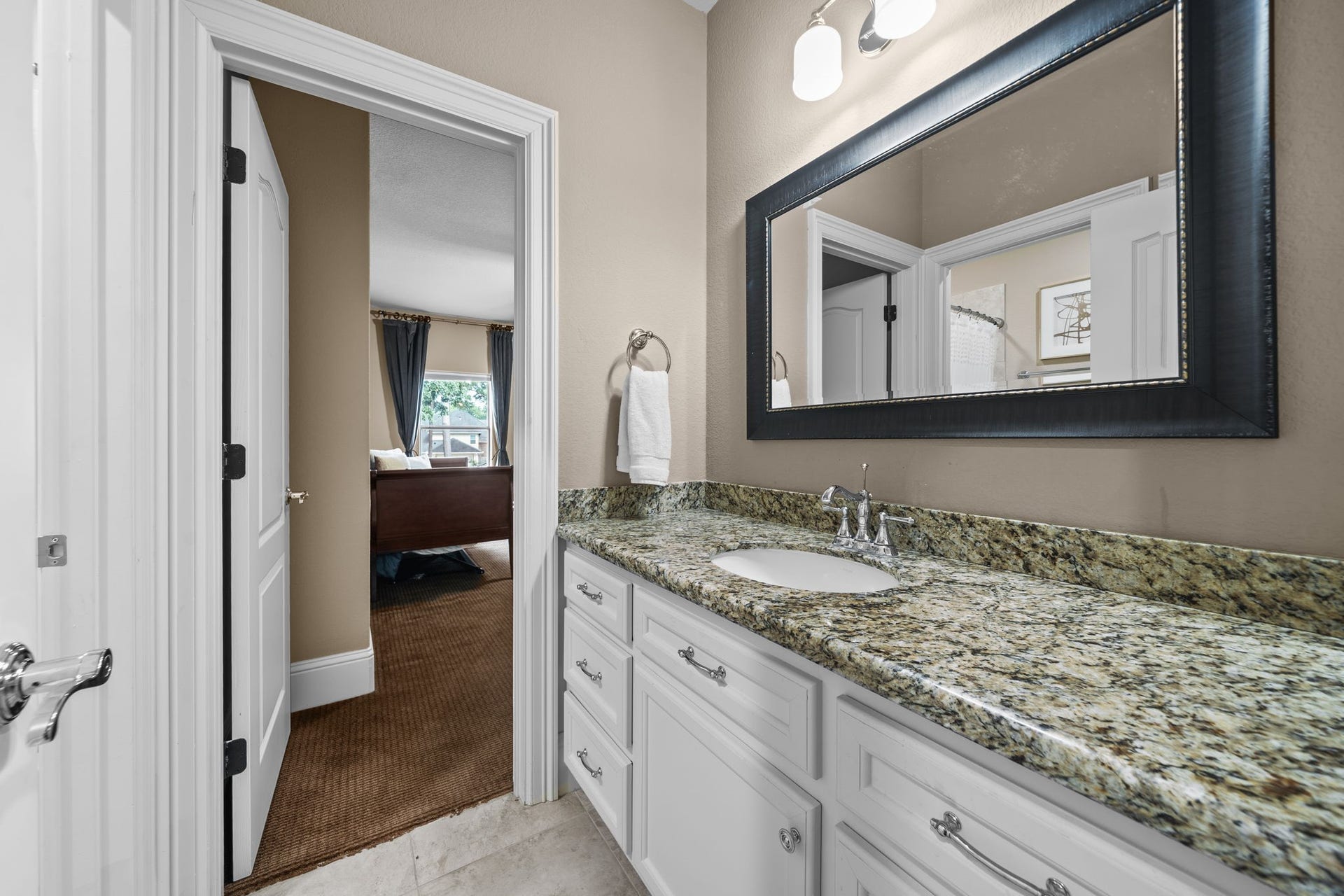 4426 Silver Jade Drive, Spring, TX 77386 Two of the expansive upper-level retreats feature an elegantly integrated dual-entry bath, offering a seamless and highly functional architectural layout.